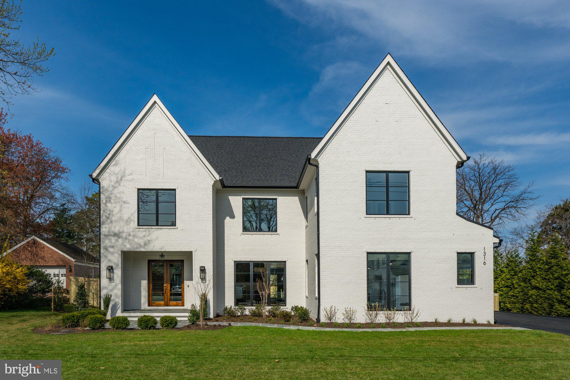 Cherry Hill Custom Homes presents this beautiful all-brick transitional design currently under construction on a flat, 20,000 sq ft lot in sought after Salona Village. This home features 6 bedrooms, 6 full bathrooms, and one powder room with 8,341 square feet of finished living space over three levels, a three-car attached garage, and dual staircases. The main level includes 10ft ceilings, gorgeous wide-plank engineered white oak wood floors, a beautiful gourmet kitchen with frame-less custom cabinetry and quartz countertops and a rear prep kitchen/pantry. The kitchen connects to a great room with coffered ceiling and gas fireplace with tile surround and a spacious breakfast nook overlooking the backyard. The screened porch with gas fireplace and stone surround and the rear flagstone patio provide two amazing outdoor living spaces. An elegant formal dining room with butler's pantry,  an en-suite bedroom or private study, and mudroom with built-in cubbies complete the main level living spaces. The upper level is highlighted by a luxurious primary suite with gas fireplace, spacious dual walk-in closets with built-ins, and a spa-like bathroom with heated floors, double vanities, stand-alone soaking tub, and heavy glass enclosed shower. The walk-up lower level includes a recreation room with wet bar, a large exercise room with rubber flooring, and an additional en-suite bedroom. This home has a built-in elevator shaft for optional conversion. Convenient to all the shops and restaurants of downtown McLean. Delivery March 2026. Interior photos are from another home recently built by Cherry Hill Custom Homes. Actual finishes may differ from what you see in the listing photos. Still time to choose finishes.