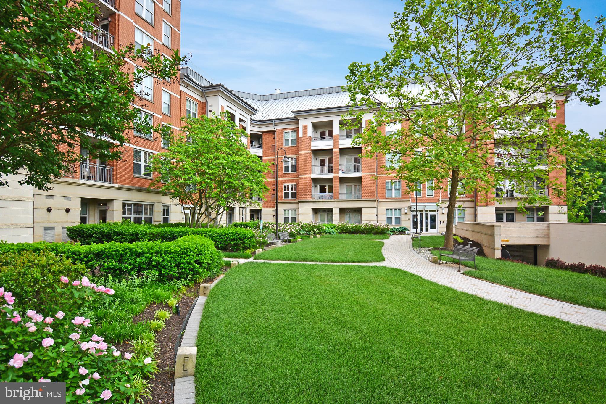 SECURE BUILDING  - (Open House ACCESS to secured building,   Contact  ***7 0 3*** 869*** 7368 *** IN ADVANCE OF ARRIVAL)  One of the largest Model's at 1072 Sq Ft
"Luxurious Two Bedroom, Two full bath suite, extraordinarily spacious condominium w/elegant style, custom finishes throughout tinted windows, core doors throughout, Baltic brown granite, custom cabinetry design layout, dimmable track lighting from 9.5 ft ceilings to engineered hardwood flooring and state of the art technology interface. Owner advises "Ultimately the best location in the entire complex for comfortable open space experience inside and outside allowing for convenient functional freedom of movement eliminating the hassle of using stairs, elevator's and doors for groceries, recreation and light weight logistics. Given the buildings position and the units location, compared to others with the patio doors and front door open it allows for a refreshing " jet stream air current" that occurs  providing for a unique air flow/oxygenation in the unit when  desired. Current owner loves the location and this unique characteristic that periodically allows for uninhibited air flow through the unit. 

Amazing expansive  Inner Corner, Two Suite, Main Floor Condominium.  Features Bamboo Engineered wide plank floors,  solid doors, Crown Molding, Granite Counters, Stainless Appliances, Gas Heat and Gas Cooking.   11770 is the Original Builders design with 9+ foot ceilings, wide hall ways, easy access within and out of the building. Mercer features security throughout the premises. Onsite Concierge, Onsite Management, Secured Access Work Out Gym, Secured Access Entertainment Room with Bar/kitchen and dining entertainment area. Mercer is walking distance to Reston Town Center, Silver Line and the new Wegman's. 
Reston community features Walking and Biking Trails, Community Centers, Picnic Pavilions,  Playing Fields including basketball, baseball and soccer. There are numerous Pools and Tennis Courts. Reston's community lakes allow for canoeing, paddle boarding and  boating. Reston Town Center provides a selection of fine dining, shopping and entertainment. Stop in to Reston's Apple Store, Jackson's Fine Dining, Starbucks, the Barcelona Wine Bar, Fogo de Chão Brazilian Steakhouse, Morton's  or True Food Kitchen. Enjoy a summer concert at  the Pavilion. 
Google, Microsoft, Oracle  all have offices here in Reston. 
This Sheridan Model Condominium at 1072 Sq Ft is one of the larger models in the Mercer. It features the open floor plan with open kitchen, granite bar/work  area, extra cabinetry, light filled rooms, custom track lighting. The dual suite bedrooms with full baths, soaking tubs and  large walk-ins are refined spaces for respite and relaxing. The living spaces and kitchen are open and bright. perfect for entertaining or an intimate evening home.  This truly is one of the best located units in the building having easy access to everything. The Main Floor location here is perfect. Literally just steps to the Gazebo Patio,  and steps  to Elevator access to the two protected assigned parking spaces for this home, and easy access to the exterior via the Condo's Patio. The Condo looks over the aesthetics of community gardens. This is refined living at it's best.
Home has two assigned garage spaces!