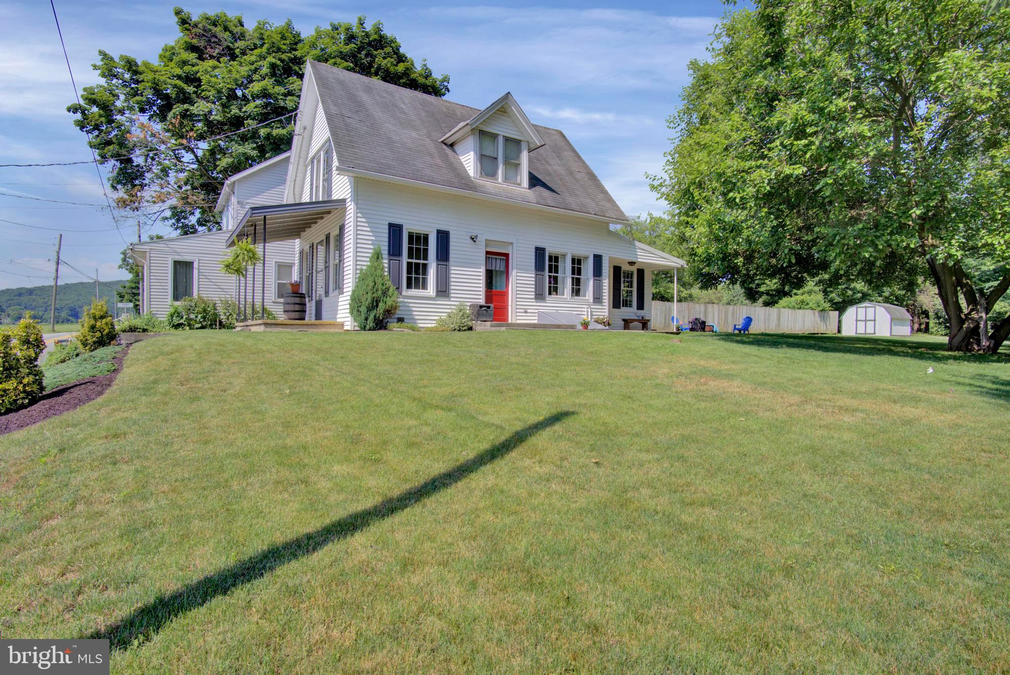 Country living with easy access to major roadways, shopping, and dining! This beautiful cape cod has been lovingly maintained and updated by the current owners, while keeping its original charm! Bright and airy home is highlighted by an open kitchen with updated countertops and cabinets along with new stainless appliances and luxury vinyl flooring. The first floor also features a traditional living and dining area with a neutral palate and original woodwork, a main floor full bath with updated vanity, and a separate laundry room with stacked washer and dryer. The second floor holds two nicely sized bedrooms accented with neutral paint and carpet, making move-in a breeze! Step outside and breathe in the country air! Enjoy home grown vegetables from your garden, which is conveniently located just off the kitchen porch. Tomatoes, peppers, radishes, and cucumbers are already planted for you! Two covered porches and a large yard provide plenty of room for entertaining  guests or just relaxing! Let your pets enjoy the outdoors while keeping them safe with the underground containment fence. The basement and shed provide storage for all your necessities! With a new septic tank (2018), updated forced air heater (2015), and replacement windows in the kitchen and living room all you need to do is move in!  Add your personal touch and call it home! Agents please see agent remarks.