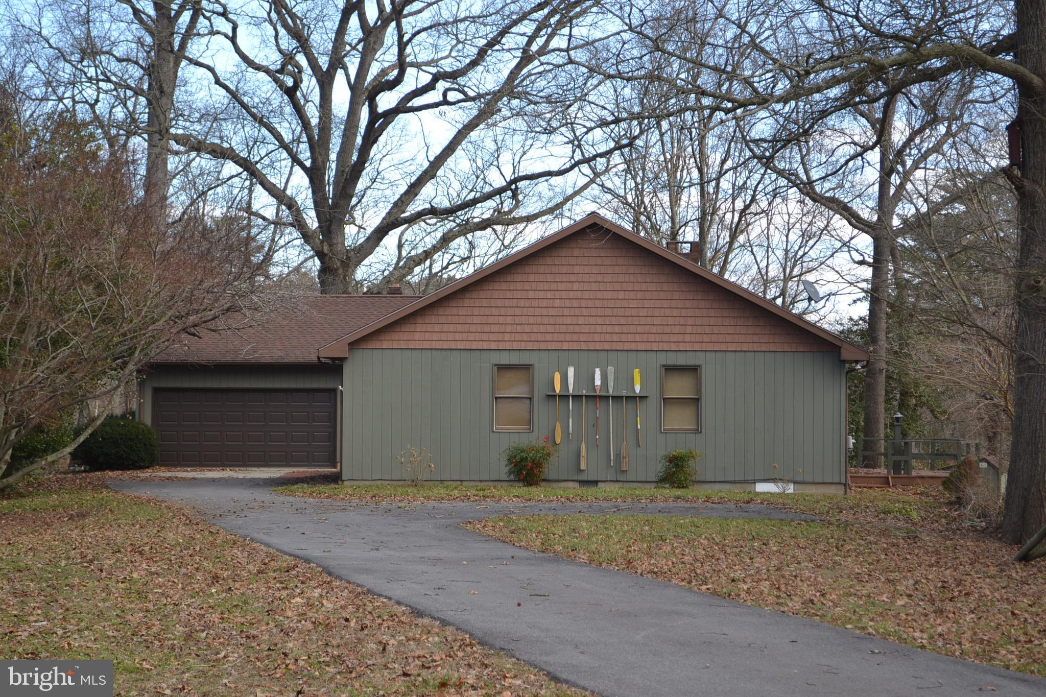 Excellently maintained 3 bedroom, 2.5 bath, located on River Road just outside Denton near school, furnished, dock, deck, screened porch, 2 car garage/activity room,  on 5+/- acre point on the Choptank River.