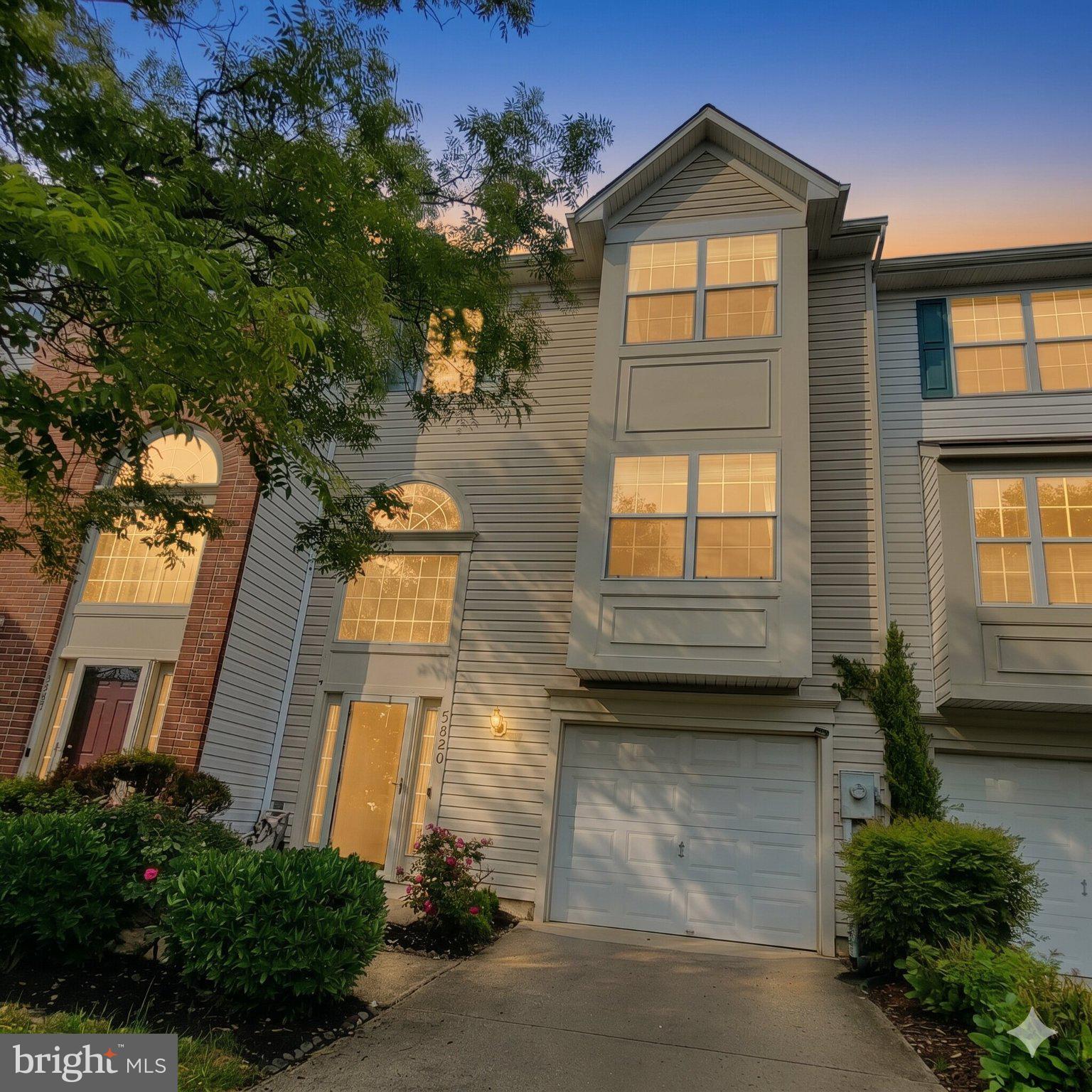 5820 Blue Sky Way | Elkridge, MD 21075
3 Bedrooms | 2.5 Bathrooms | Lyndwood Community

Welcome home to this well-maintained townhome in the sought-after Lyndwood community of Elkridge, offering a functional three-level layout, thoughtful architectural details, spacious common areas, and numerous recent updates.

From the moment you arrive, the home offers strong curb appeal with front box bay improvements, updated PVC exterior trim (2025), concrete driveway, and private garage. Major system updates include roof (2018) and HVAC (2018). The water heater was replaced in 2015. An EV Level 2 240V/32A charger (2024) adds significant value and convenience for electric vehicle owners.

Step inside to a bright two-story foyer highlighted by a half-round architectural window and tiered chandelier. The main level features open living spaces with fresh interior paint (2026), recessed lighting throughout (2026), and a convenient powder room. The kitchen includes refreshed cabinetry (2026), tile backsplash (2023), center island, breakfast area, and ample cabinet and counter space.

The upper level offers 3 bedrooms and 2 full bathrooms, including a spacious primary suite with vaulted ceilings, walk-in closet, and soaking tub.

The finished lower level provides a versatile recreation space ideal for a home office, gym, media room, playroom, or additional living area, with walk-out access to the covered under-deck patio and backyard area.

Outdoor living includes a large deck with updated stairs, freshly painted deck (2026), covered under-deck patio, storage shed (2024), landscaped outdoor space, and a larger rear yard than typical townhomes. The home backs to open community green space, enhancing privacy and outdoor enjoyment.

Convenient access to I-95, Route 100, Baltimore, Washington D.C., Columbia, Arundel Mills, BWI Airport, shopping, dining, and parks. Located within the Howard County Public School System.

Updates!
EV Level 2 240V/32A Charger (2024), Ring Wired Doorbell, Garbage Disposal (2025), Front Box Bay Improvements (2025), PVC Exterior Trim (2025), Kitchen Cabinet Refresh (2026), Interior Paint (2026), Recessed Lighting (2026), Deck Painted (2026), Storage Shed (2024), Kitchen Backsplash (2023), Deck Stairs (2020), Under-Deck Patio (2020), Roof (2018), HVAC (2018), Water Heater (2015).