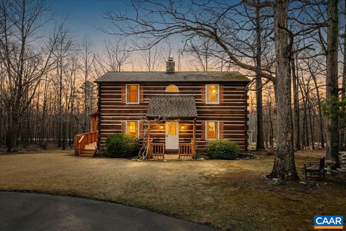 Back on market, no fault of seller! Seller has replaced main beam and has replaced several logs. Tucked away in the peaceful Wilde Acres neighborhood, this beautiful home offers the perfect balance of privacy, character, and comfort. Inside, you?re welcomed by stunning wide-plank heart pine flooring that brings warmth and timeless character to the living space. A newly updated shower adds a fresh, modern touch and makes the bathroom feel clean, bright, and relaxing. The property sits on 3/4 of an acre, with a well-manicured and intentionally landscaped yard that creates a peaceful outdoor setting. Two additional Lots available nextdoor .25AC and .27AC. There?s plenty of room to enjoy quiet mornings, entertain guests, or simply take in the natural surroundings. A detached 2-car garage offers excellent space for parking, storage, or a workshop. If you?ve been looking for a home that combines natural beauty, usable space, and thoughtful updates, this one is worth seeing in person.