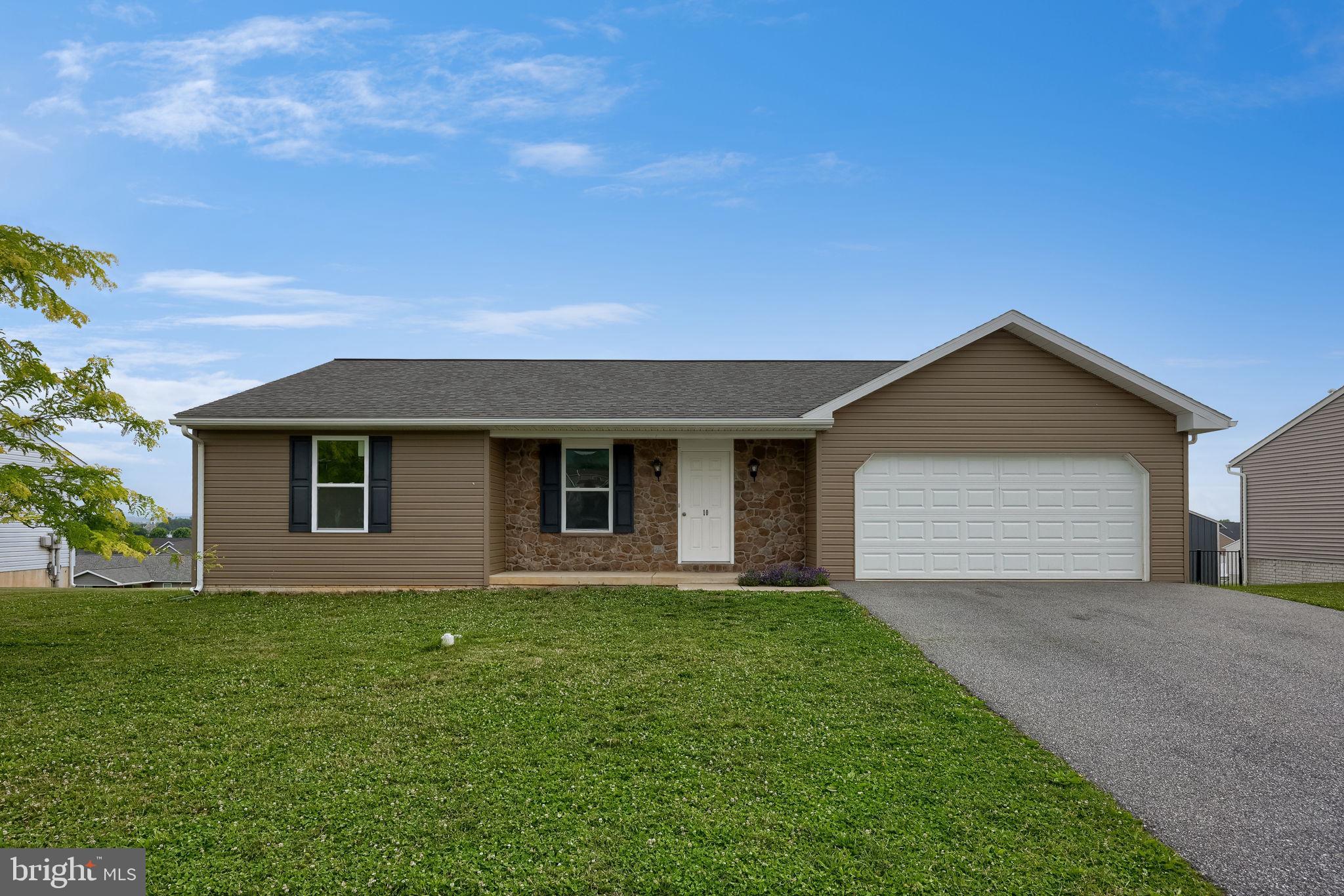 Welcome to 10 Hillside Drive! This ranch-style home offers 3 bedrooms, 1 1/2 bathrooms, and over 1,200 square ft of living space! The open floor plan makes the living space feel large and flows seamlessly from the living room to the kitchen and dining area. There is a sliding glass door that steps out onto a deck with great views, making it the perfect spot for enjoying the outdoors! In addition, there is a laundry room and a half bath, and interior access to the 2-car garage. The possibilities are endless with the unfinished lower level, which could be finished into a secondary living space, a 4th bedroom, or a combination of finished space and storage. Don't delay, schedule your private tour today!