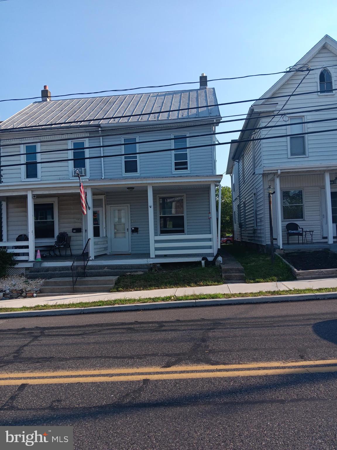 Prime Camp Hill Borough location for this single family residence located in the Downtown District zoning of Camp Hill Borough.   Located directly across from Cornerstone Coffee Shop.  Features long yard leading to alley with 2 parking spaces at the end.  Across the alley is the municipal parking lot with public parking.  Many updates including Roof 2015, siding and spouting  2020.  Duct work for Central Air is in home.  Gas to house.  Updated kitchen.   Half bath on 1st floor.    Bedroom at back of house has side porch.   Front bedroom has double closets.  Front porch  and back  side patio area.   Cash offers only. Sold as is.
