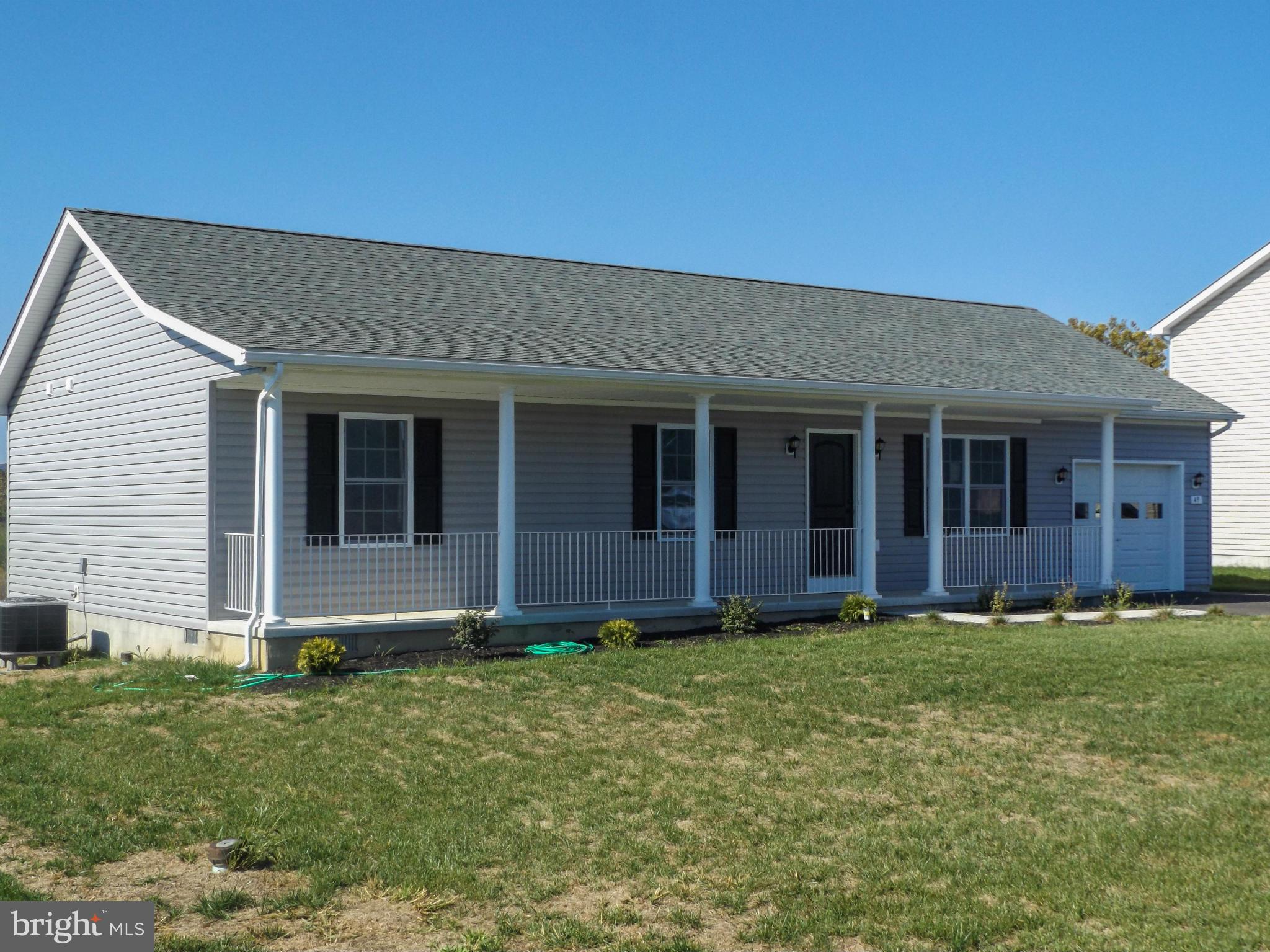 This ranch style house features 3 bedrooms and 2 baths with hardwood floors in living room, kitchen and dining room. Bedrooms have carpet. Hallways are wider and handicap accessible.