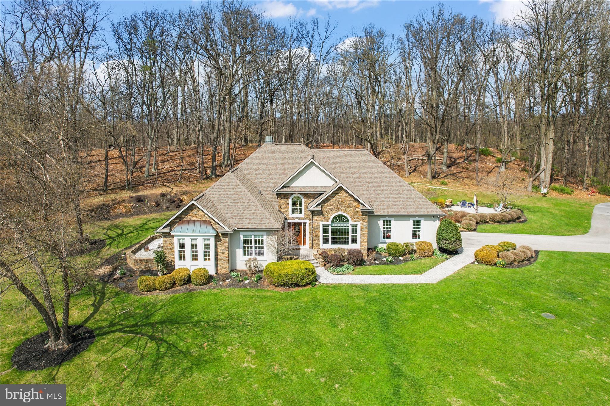 Tucked away on 27 private acres in the beautiful Pigeon Hills, just north of Hanover, this sprawling, custom-built rancher offers the perfect blend of class, comfort, and everyday functionality—all surrounded by rolling fields, wooded privacy, and incredible views.

Inside, you’ll find 3 bedrooms and 2.5 baths, with thoughtful details throughout, including hardwood floors (some with custom inlays), tile, chair rail, crown molding, and a mix of cathedral, vaulted, coffered, and double tray ceilings. Large windows and skylights fill the home with natural light, while two fireplaces add warmth and charm. The spacious kitchen features an island and pantry, and the main-level laundry adds everyday convenience. Entertain with ease thanks to the wet bar and inviting living spaces.

The primary suite is its own private retreat, complete with a spacious sitting area featuring custom built-ins and direct access to a private patio—perfect for quiet mornings or unwinding at the end of the day.

Step outside and enjoy multiple patios and a screened-in porch, ideal for taking in the peaceful surroundings. The land offers a beautiful mix of open space and woods, with trails for riding ATV's or just meandering about! 

Car enthusiasts, hobbyists, or anyone needing extra space will appreciate the attached garage for everyday convenience, a detached garage for additional storage or workspace, and a newer 24x48 pole building with a 14' door and 16' rafters—perfect for storing boats, campers, equipment, or all your outdoor toys. There’s also plenty of paved parking to accommodate it all with ease.

For added peace of mind, the home is equipped with a generator capable of powering essential systems during an outage.

With room for horses, space for future outbuildings, and endless possibilities, this property offers the privacy, flexibility, and lifestyle you’ve been looking for.