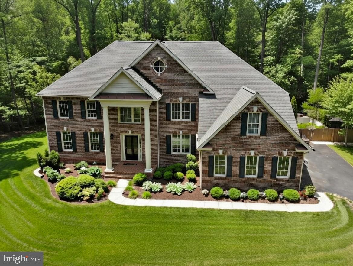 Welcome to this extraordinary custom-built estate offering over 6,000 finished square feet of refined living space, 5BR ,4.5 Baths, 3 car garage w/ custom storage, all conveniently located on a private 1.5-acre level lot backing to serene woods and mature trees. Thoughtfully and extensively remodeled within the past year, this home blends timeless elegance with today’s most sought-after upgrades.
At the heart of the home is a stunning, fully redesigned Chef’s kitchen featuring an expansive center island, premium stainless steel appliances, quartz countertops, and high-end custom cabinetry—designed to impress and built for everyday living. Newly refinished hardwood floors flow throughout the main level, enhancing the home’s warmth and sophistication.
The dramatic two-story family room showcases a floor-to-ceiling stone fireplace and walls of windows that flood the space with natural light. A spacious rear office with a distinctive picture window offers inspiring views of the backyard and visiting wildlife—perfect for working from home in tranquility.
Upstairs, the luxurious owner’s suite is a true retreat, complete with a newly remodeled spa-like bath and multiple walk-in closets. Three additional generously sized bedrooms feature beautifully updated Jack-and-Jill baths and one en-suite bath, offering comfort and style for family and guests alike.
The finished daylight walkout lower level is designed for entertaining and relaxation, offering a large game room, media/TV room, full bath, and opportunity for a fifth bedroom. An expansive unfinished storage area—with full-size windows—provides exceptional potential for future finished space. Step directly outside the full walkout to your private outdoor oasis. Enjoy your own resort-style retreat featuring an incredible in-ground custom saltwater Gunite pool with waterfall, extensive concrete decking, auto retractable pool cover, and an enormous elevated Trex deck overlooking the grounds—perfect for gatherings or peaceful evenings under the stars.
All this privacy, yet just minutes to premier shopping, dining, top-rated schools, and major commuter routes.
This is more than a home—it’s a rare opportunity to own a truly one-of-a-kind jewel. Do not miss out! Please submit all offers by 9AM Monday 4-20-2026