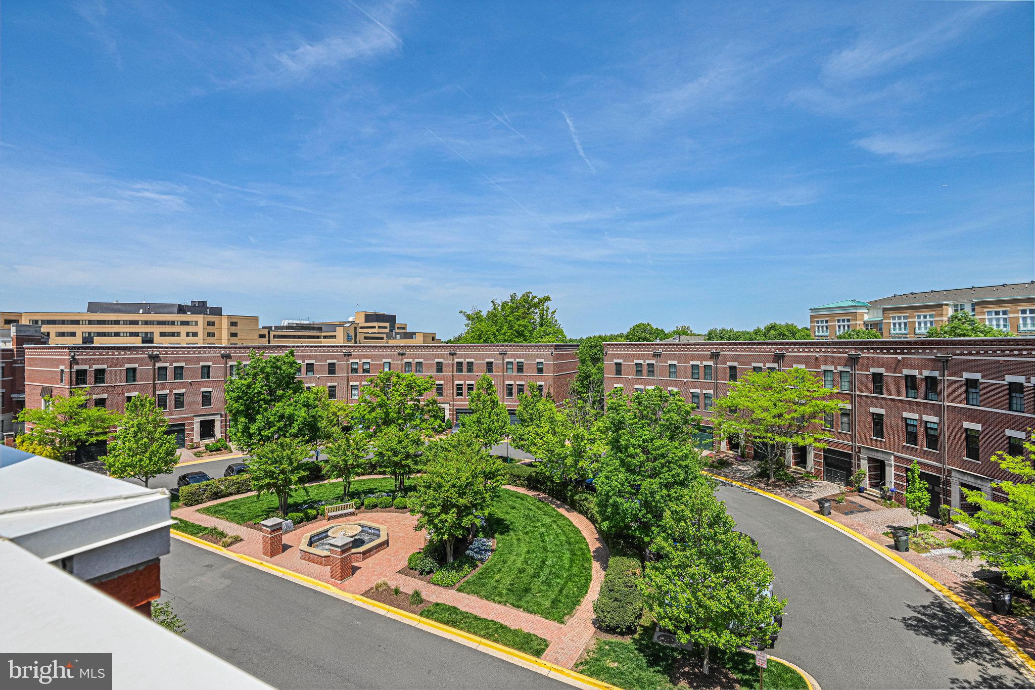Open Houses canceled. Property is under contract!  Welcome to 12127 Chancery Station Circle!  This elegant 4-Level Townhome is in West Market, a rich collection of stylish all brick townhome residences located across the street from the live-work-play oasis that is Reston Town Center. The Town Center offers a vibrant mix of dining, nightlife, shopping, entertainment, and more all within walking distance of 12127 Chancery Station Circle.  The West Market townhomes combine the best of both worlds – the charm of a traditional neighborhood with the walkability of a bustling urban lifestyle. Commuting is a breeze with Reston Metro station within walking distance as well as Reston Hospital.  With easy access to major roadways, convenience is at your doorstep.  This exquisite 4-level townhome features a thoughtfully designed layout with 3 outdoor entertaining areas and an open-concept main living area all flooded with natural light. The main living area highlights a spacious kitchen with stainless steel appliances, crisp white cabinetry, wine bar and beverage cooler. The kitchen opens up to a wonderful deck with remote control awning and wind sensor.  Also on this floor, you’ll find a sunlit great room with a dining and family room area. The lower level features a tiled foyer, spacious closet, access to the garage (with EV charger), a full bathroom, and a bedroom. This versatile room could be used in many ways – bedroom, exercise room, guest suite, or office.  It also provides access to the brick patio and fenced backyard.  The 2 bedrooms on the 3rd level feature ensuite bathrooms and flank the newly remodeled laundry area with an LG Tower Washer/Dryer and barn door.  Head up to the 4th floor and find a great room with wet bar, beverage cooler, shelving, gas fireplace and access to the beautiful rooftop deck – making entertaining a dream. Enjoy exceptional views of Reston and the Reston skyline from the rooftop terrace. This location can’t be beat – walking access to Reston, walking trails, the W&OD trail, Reston Metro, Reston Hospital, commuter routes, and Dulles Airport all minutes away! If you’re looking for an exceptional in-town lifestyle with a suburban feel, this is the home for you!