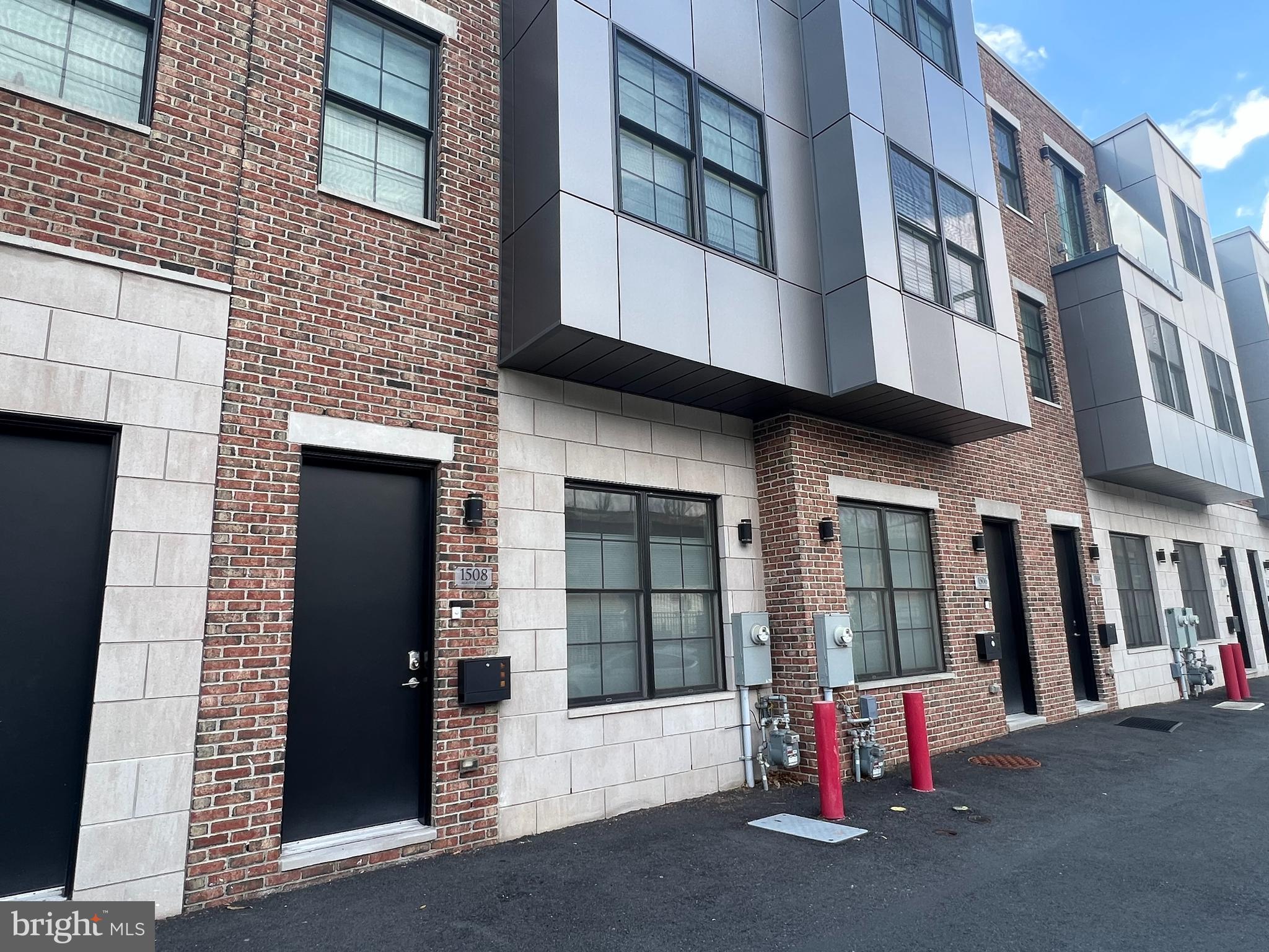 Welcome to 1508 S. 25th Street. This gorgeous and newer construction home is located in GraysPointe, a private residential community at the edge of Point Breeze and Grays Ferry in South Philadelphia. This meticulously built, extra wide (16ft), 3 story home comes with 1 designated parking spot. Enter the modern home, into a spacious and brightly sun-lit grand room, which features recessed lighting, large casement windows, fire place, speakers, crown molding, high ceilings and hardwood floors. The gourmet chefs kitchen is equipped with is a large center island, butler pantry, high end Samsung Stainless Appliances, soft close Shaker style cabinetry, solid stone counters, custom pendant lighting above, chef's faucet, and contemporary backsplash. From the kitchen, via sliding door, you will also have access to your private backyard. On the second level of the home you will find two spacious and sun-lit bedrooms, a contemporary bathroom, and laundry room. The third level of the home has the dreamy master suite; an extra large bedroom with a bay window, generous walk-in closet, wet bar, and a spa-like bathroom. The luxurious bathroom is appointed with imported tile, seamless glass shower enclosures, dual vanity, modern free-standing tub and rainfall shower heads. The third floor steps lead you to the pilot-house where you will find the access to your private rooftop deck. Directly above, find your own personal roof-deck with 360-degree views of the Philadelphia skyline, excellent for homeowners who enjoy entertaining their guests. The finished basement can be used as a bedroom, entertainment area, den, or office. The basement also houses a full bathroom, and utility room. The home is outfitted with a fire sprinkler system, cable outlets, modern vanities, casement windows, Video doorbell system, Nest Thermostats, Schlage combo deadbolt, USB outlets in bedrooms, Bluetooth speakers, Low VOC paint and much more! Pets case by case. Located near Rittenhouse Square, UPenn, shopping, and much more!. Come check it out!