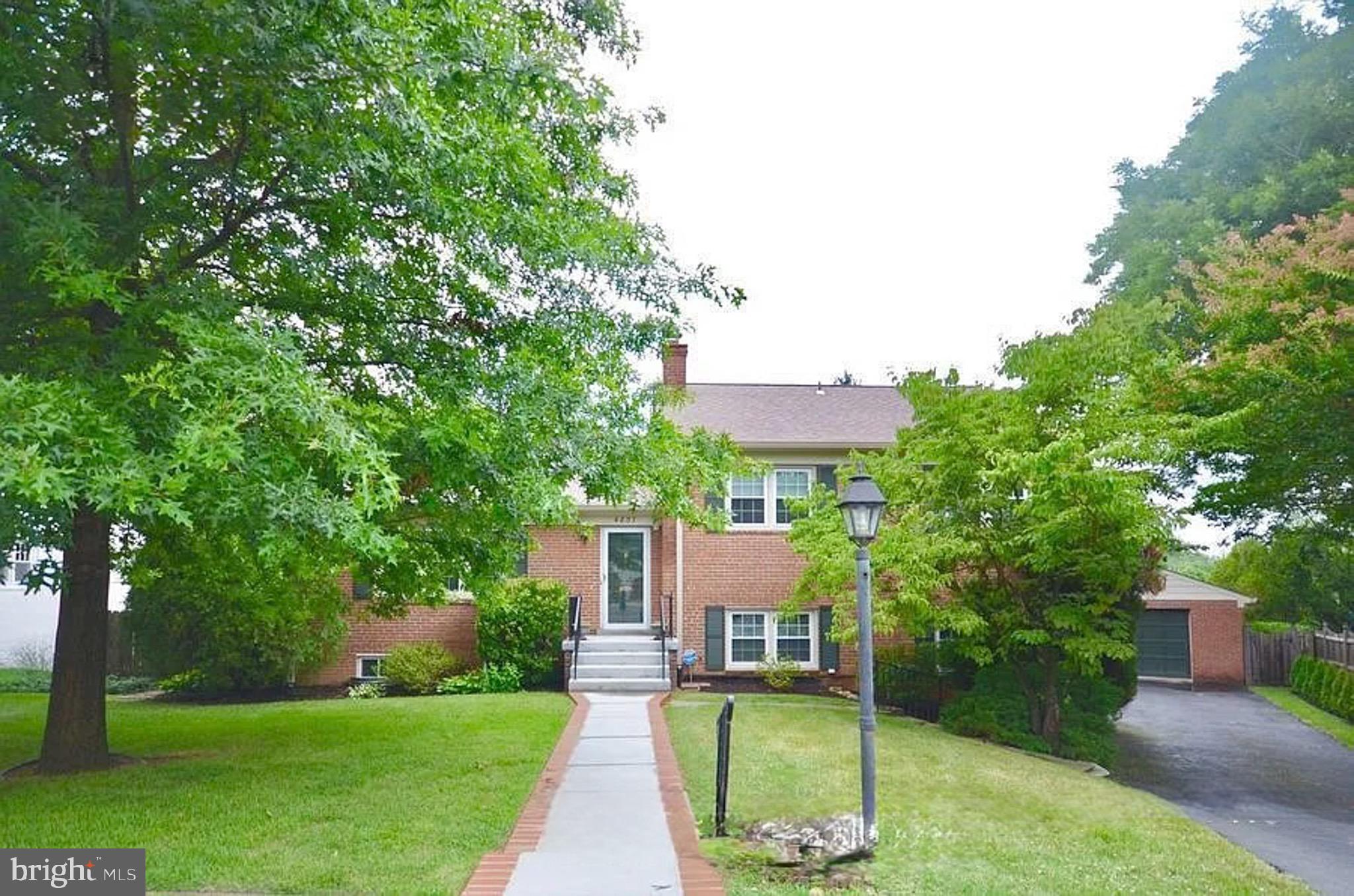 Spacious North Arlington Home in Prime Location

This bright and airy split-level home features a two-story addition and boasts fresh paint and gleaming hardwood floors throughout. Enjoy a screened-in deck with a two-story ceiling that backs to mature trees, offering a private outdoor retreat.

The main level includes a spacious formal living room that flows into the dining area, leading to a family center complete with built-in bookcases and a full bathroom. The kitchen is well-equipped with ample cabinet space, skylights, and a charming breakfast nook.

Upstairs, the primary bedroom offers an ensuite bathroom with a stall shower, along with two additional guest bedrooms that share a full hall bathroom.

The first lower level provides another two guest bedrooms, a full bathroom, and a convenient laundry center. Descend to the final lower level to find a den with more built-in shelving and a recreation room with walk-out access to the fully fenced backyard.

Outdoor amenities include a patio with access to a grill deck, a screened-in deck, and a two-car garage with a workshop and storage space.

Ideally situated on a quiet cul-de-sac, this home is just one block from Jamestown Elementary School and within walking distance to parks and the Metrobus. Commuting is a breeze with easy access to Crystal City, Washington D.C., and Tyson's Corner. This home is located within a highly desirable school district.