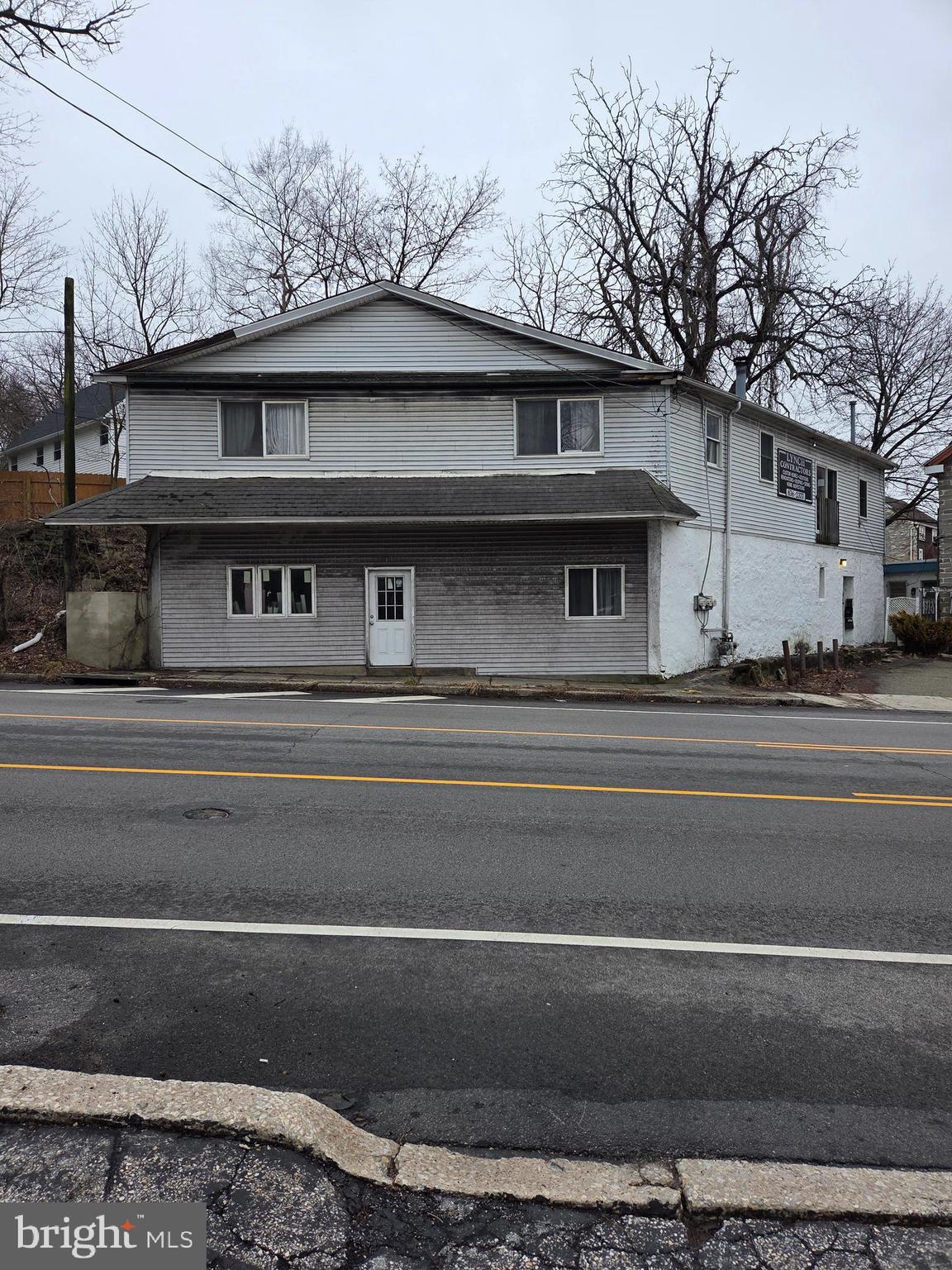 Rare opportunity to own a mixed-use commercial property in desirable Erdenheim along Bethlehem Pike with convenient access to major routes. The first floor unfinished  warehouse space is being used by the Seller. The second-floor features two updated two-bedroom apartments with kitchens, baths, and living/dining areas. A separate side entrance provides access to the apartments, laundry rooms, and mechanical area. . An additional room on the first floor is already plumbed for a future full bath. Property is being sold in its present condition. Seller will make no repairs or improvements, including any Township Use & Occupancy requirements. Buyers and buyers' agents are responsible for verifying any intended use with the Township. Minimum 24-hour notice. All Offers Considered!