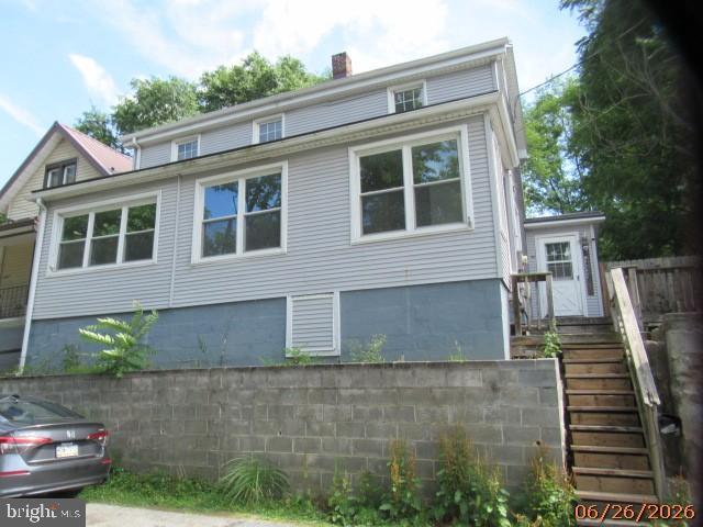 Home features a spacious layout, including three bedrooms, one and a half bathrooms,  Laundry room, and off-street parking.