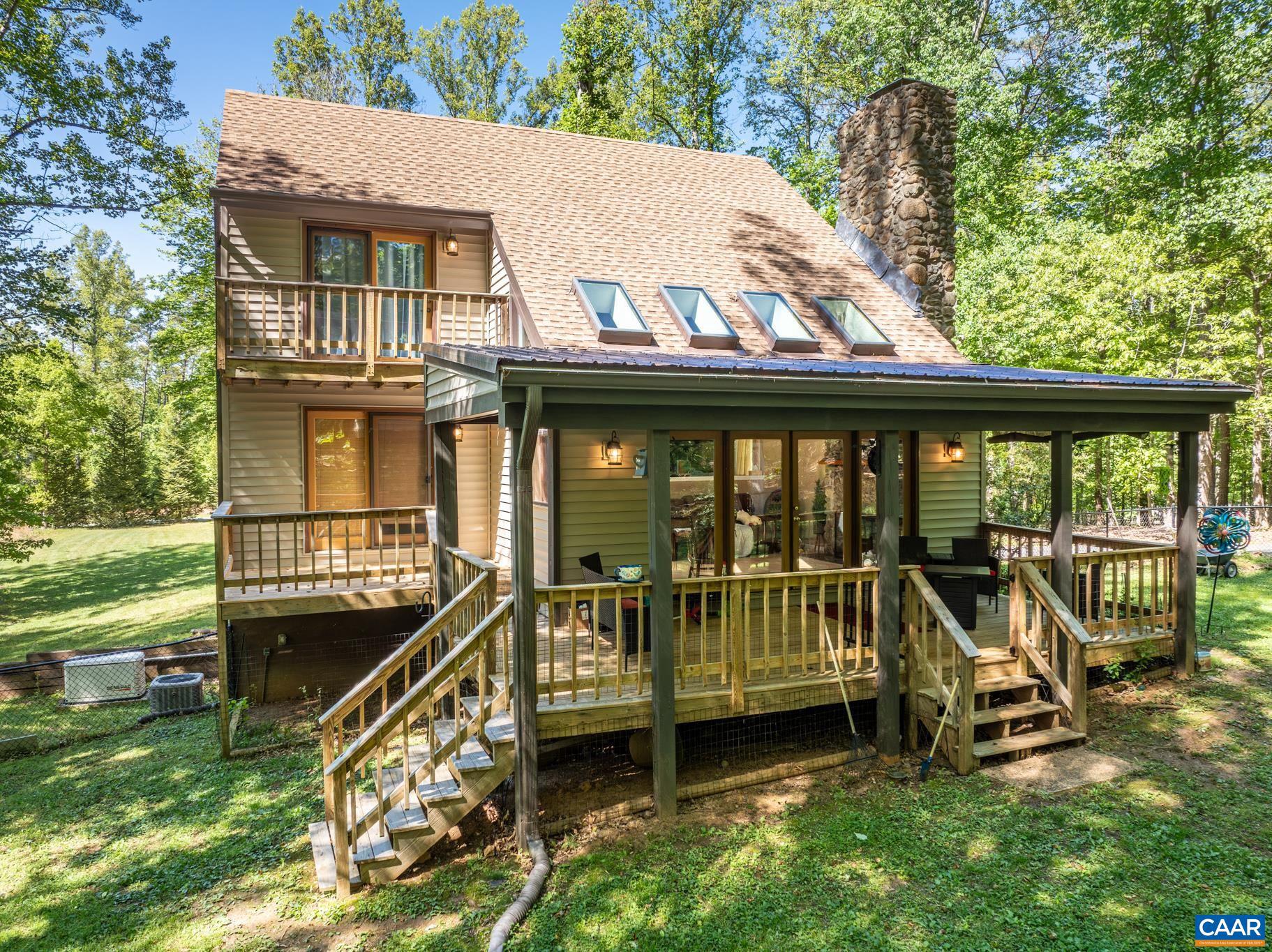 Rare Ivy Opportunity: Private Sanctuary on 2.49 Acres. Discover the ultimate Western Albemarle retreat! Secluded on a 2.49-acre lot, 2530 Gillums Ridge Lane offers the perfect blend of move-in ready peace and a premier Ivy location. Whether seeking a sophisticated starter home or a quiet country getaway, enjoy a lifestyle of total privacy just minutes from Crozet and UVA. Step into a light-filled interior featuring a vaulted family room with a dramatic stone fireplace. The unique, efficient floor plan maximizes every inch, offering three bedrooms with generous walk-in closets and private deck access for each. Unbeatable peace of mind comes with over $27,000 in recent 2026 upgrades, including brand-new premium vinyl siding, fully repaired/replaced decks, gutters, trim, and exterior lighting. These join a list of significant updates: a remodeled full bath (2023), new skylights (2024), and a modern septic system (2020). As an added bonus, the seller is offering a $5,000 credit at closing with an acceptable offer! Outdoor living is a dream with a fenced pet area, spacious rear deck, and included whole-house generator. This is the absolute best value for acreage in Western Albemarle, priced for an immediate summer sale!,Formica Counter,Wood Cabinets,Fireplace in Living Room