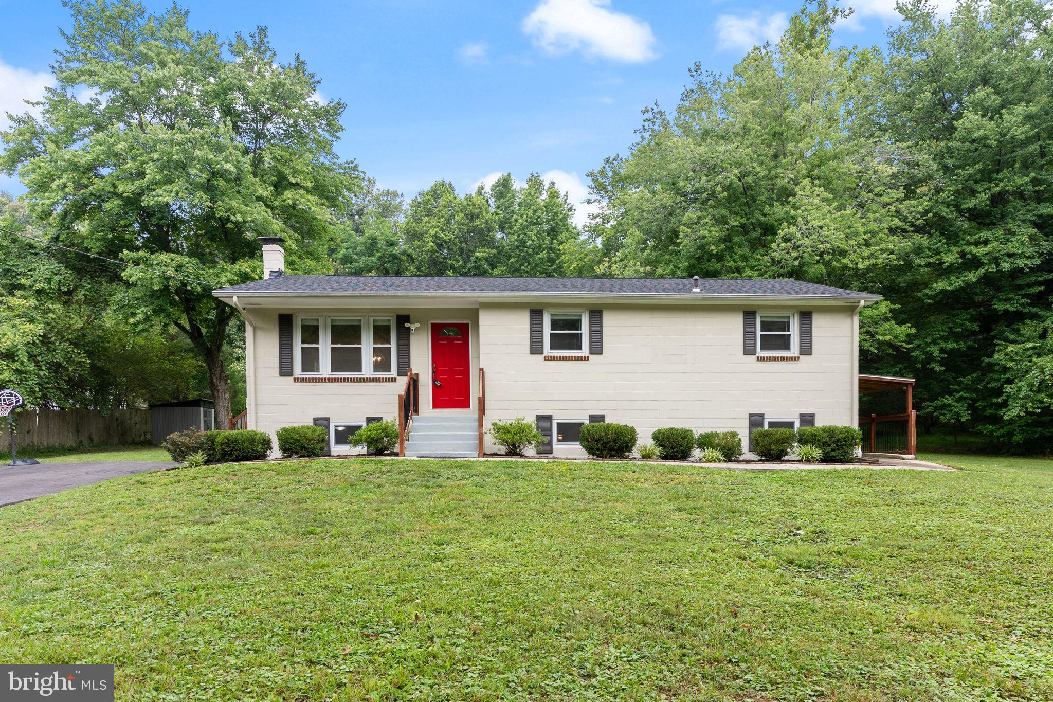 Beautifully renovated home situated on a rare 1.33-acre lot with no HOA and no restrictive covenants, offering exceptional flexibility for vehicles, equipment, recreational toys, or future outdoor enhancements. 
A professionally waterproofed basement with transferable warranty, an updated whole-house water filtration system with UV light and automatic flush feature, and a hot water heater replaced approximately one year ago.
The renovated kitchen serves as the heart of the home and features granite countertops, updated cabinetry, designer tile flooring, recessed lighting, stainless steel appliances, and a built-in microwave that is only six months old. A new stainless steel stove will also be installed. An additional countertop with extra cabinetry creates an ideal breakfast nook, coffee station, or workspace, maximizing both functionality and storage.
The spacious living and dining area offers an open, inviting layout highlighted by hardwood flooring, decorative crown molding, an elegant chandelier, and abundant natural light. A convenient side entrance provides direct access to the driveway. The main level includes three comfortable bedrooms and a beautifully renovated full bath with updated finishes.
The finished lower level significantly expands the home's versatility with a large recreation room featuring recessed lighting, multiple storage closets, and a walkout exit to the side yard. Additional finished spaces include a dedicated exercise room with laundry closet, full-size smoked stainless steel washer and dryer, and utility sink; a private flex room ideal for a home office, hobby room, or gym; a finished storage room currently utilized as a pantry; and an additional bedroom with oversized ceramic tile flooring, window, and closet that is currently used as an office.
Outside, the expansive 1.33-acre property provides endless possibilities for entertaining, gardening, recreation, or future expansion. With ample open space and no HOA restrictions, owners can enjoy a level of freedom rarely found in today's market.
Conveniently located near shopping, dining, schools, commuter routes, and everyday amenities, this move-in-ready property offers the perfect blend of updated comfort, flexible living space, and exceptional outdoor opportunity.