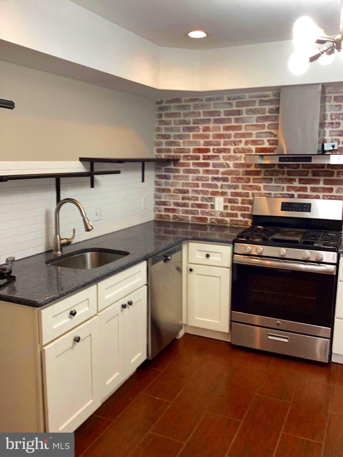 Great Investment Property. Awesome Location. It is a direct and short walk to the Temple University Main campus, restaurants and bars. A beautiful investment property that will provide an annual rental income between 23,000 and 26,000. This property has four bedrooms and two full bathrooms, large living and dining room, beautiful hardwood floors, large bedrooms, beautiful updated eat in kitchen, large cemented backyard, great outdoor entertaining space for grilling, with two rear parking spaces available to potential renters. The property bedrooms, two on each level, present their own privacy,  but each level of bedrooms has a shared bathroom with closets and big windows for great lighting. This property is freshly painted, turn key, worry free home, cleaned and move in ready conditions. Close to public transportation, hospitals and other medical facilities as well as shopping and entertainment, near downtown Philadelphia. Don't let this beautiful investment property slip through your fingers, submit your offers today.