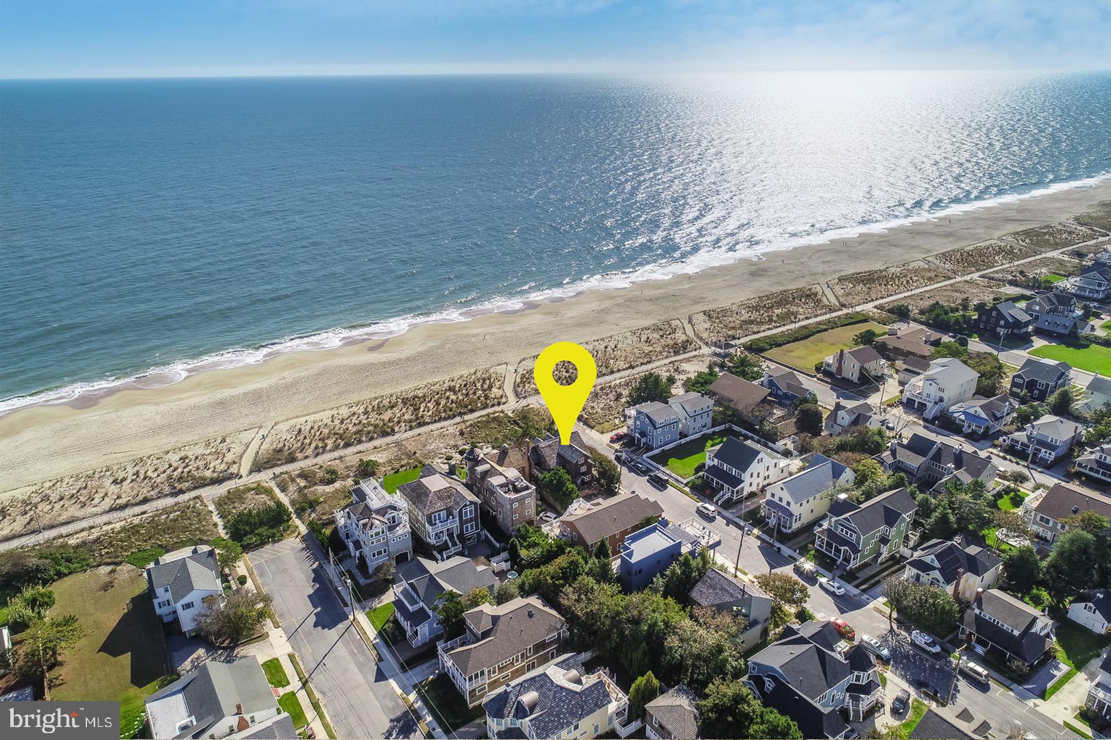 Oceanfront opportunity to own a piece of Rehoboth’s history in South Rehoboth! This shingle
style home is an icon along the southern end of the Rehoboth Beach boardwalk. Cedar siding, cedar
shingles and classic coastal charm describes this understated home dating back to the 1890’s. Situated on a corner 50’ x 250’ oceanfront parcel with southeast exposure, 1 Stockley Street features 5 bedrooms, 5 full baths, 1 half bath, and charming details throughout every square inch of this +/- 3,400 SF home. The
exterior boasts an oceanfront sundeck that allows you to enjoy beautiful views of the Atlantic and
its broad sandy beaches. While the property has gone through three renovations under the current
ownership, you can expect to see the original wood burning fireplace, pine floors, paneling and exposed beams throughout most of the home. The floorplan features a sundrenched wrap around and tiled sunroom, a family room with a wood burning fireplace, formal dining with seating for 8 or more, and a gourmet kitchen featuring shaker style cabinets, granite counters, and high-end appliances including a 5-burner gas cooktop, Bosch dishwasher, Thermador wall ovens with warming drawer, SubZero refrigerator, and a Whirlpool ice maker. The bedrooms are all located on the 2nd and 3rd levels granting the most breathtaking ocean views. Four of the bedrooms include en-suite baths offering the utmost convenience for owners and guests. This property features a rarely offered and one of the most desired locations along the Delaware Coast.