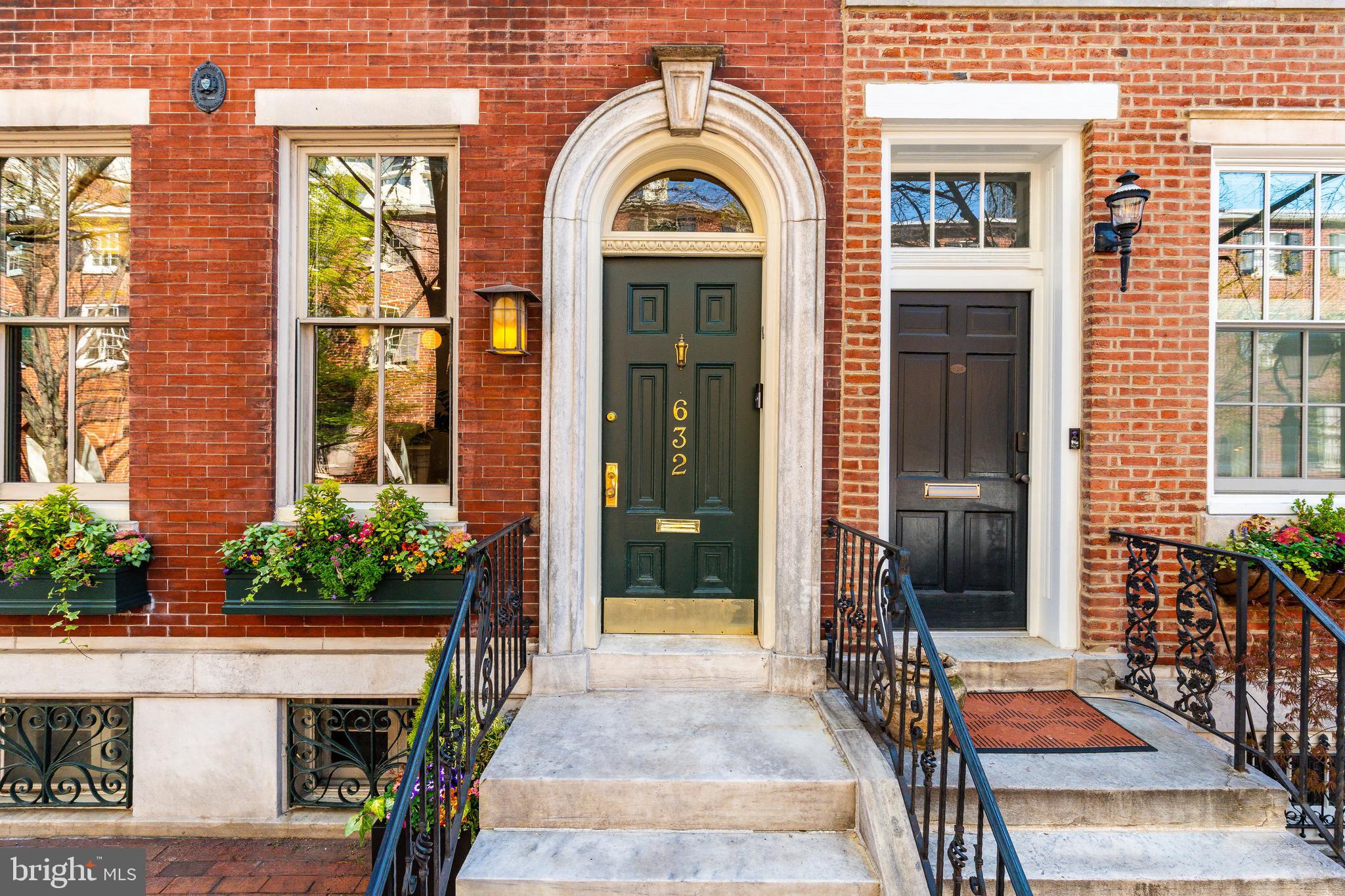 Tucked away on one of the most picturesque, tree-lined blocks in Society Hill, 632 Spruce Street is a rare offering—a 4-bedroom, 3.5-bath historic townhouse spanning 3,775 square feet with the coveted luxury of a two-car attached parking. Just ONE block from Washington Square Park and built in 1805, this 18-foot-wide residence has undergone a comprehensive renovation—seamlessly blending timeless architectural integrity with elevated modern living. Every inch has been thoughtfully reimagined to offer refined city living in one of Philadelphia’s most coveted neighborhoods. Enter through a gracious marble vestibule into a sun-soaked home graced by soaring ceilings, southern exposure, and original wide-plank pine floors—each one refinished to perfection. The formal living room features an elegant wood burning fireplace and oversized windows, while the dining room is appointed with custom built-ins and exquisite wall sconces. In 2025, over $85,000 in electrical upgrades were completed, including a new switchboard, added lighting, integrated sound wiring, and decorative enhancements. The kitchen has been updated with a striking backsplash, new dishwasher,  radiant heat limestone floors, and a sunlit breakfast nook, with a Louis Poulsen pendant, that overlooks the rear courtyard and expanded garage, accommodating two side-by-side vehicles. The second floor is anchored by a showstopping primary suite featuring a barrel-vaulted ceiling, a dramatic curved skylight, and a charming sitting area framed by bay windows. Custom Roman shades and re-stained hardwoods complete the look. The en-suite bath features a freestanding tub, marble tile, and exquisite, timeless hardware, creating a spa-like retreat within the comfort of home. A generous walk-in closet provides abundant storage. Just down the hall, the moody family room has been enhanced with expanded entry access, custom millwork, built-ins, and integrated speaker wiring. A laundry room completes the second floor. The third floor offers two versatile bedrooms. The front bedroom is beautifully bright, wrapped in Cole & Son designer wallpaper, with new floorboards, custom closet units, window shades, and plush Stark carpeting. The rear bedroom, currently used as an office, features handsome beamed ceilings, bold Missoni carpeting, and direct access to a private deck with new patio flooring—creating a breezy escape in the heart of the city. Between the two rooms lies a fully renovated marble bathroom with a glass-enclosed shower—thoughtfully designed for both elegance and functionality. The fourth-floor bedroom offers a peaceful escape beneath pitched ceilings and features an arched window that draws in soft natural light while framing leafy treetop views. The room’s tranquil palette, plush carpeting, and cozy proportions make it the perfect guest retreat, reading nook, or private home office. An impeccably updated full bath on this floor has been gut renovated, and two new skylights complete the airy, top-floor experience. No detail has been missed in this home’s extensive and tasteful renovations: a fully rebuilt roof with copper siding and reinforced masonry (2021), removal of all knob-and-tube wiring, new water pressure pump, waterproofing in the basement, refinished original marble in the entryway, and full Google Home integration, including Nest climate control, doorbell, security cameras Sonos speakers, and a whole house mesh system. The unfinished basement has been fully gutted and sealed, ready for future expansion. Located within the sought-after McCall School Catchment, this home offers not only historic elegance and high-end upgrades, but also access to acclaimed restaurants, cultural institutions, and the lush expanse of Washington Square Park. 632 Spruce Street is a one-of-a-kind opportunity to own a turnkey masterpiece in one of Philadelphia’s most beloved neighborhoods.
