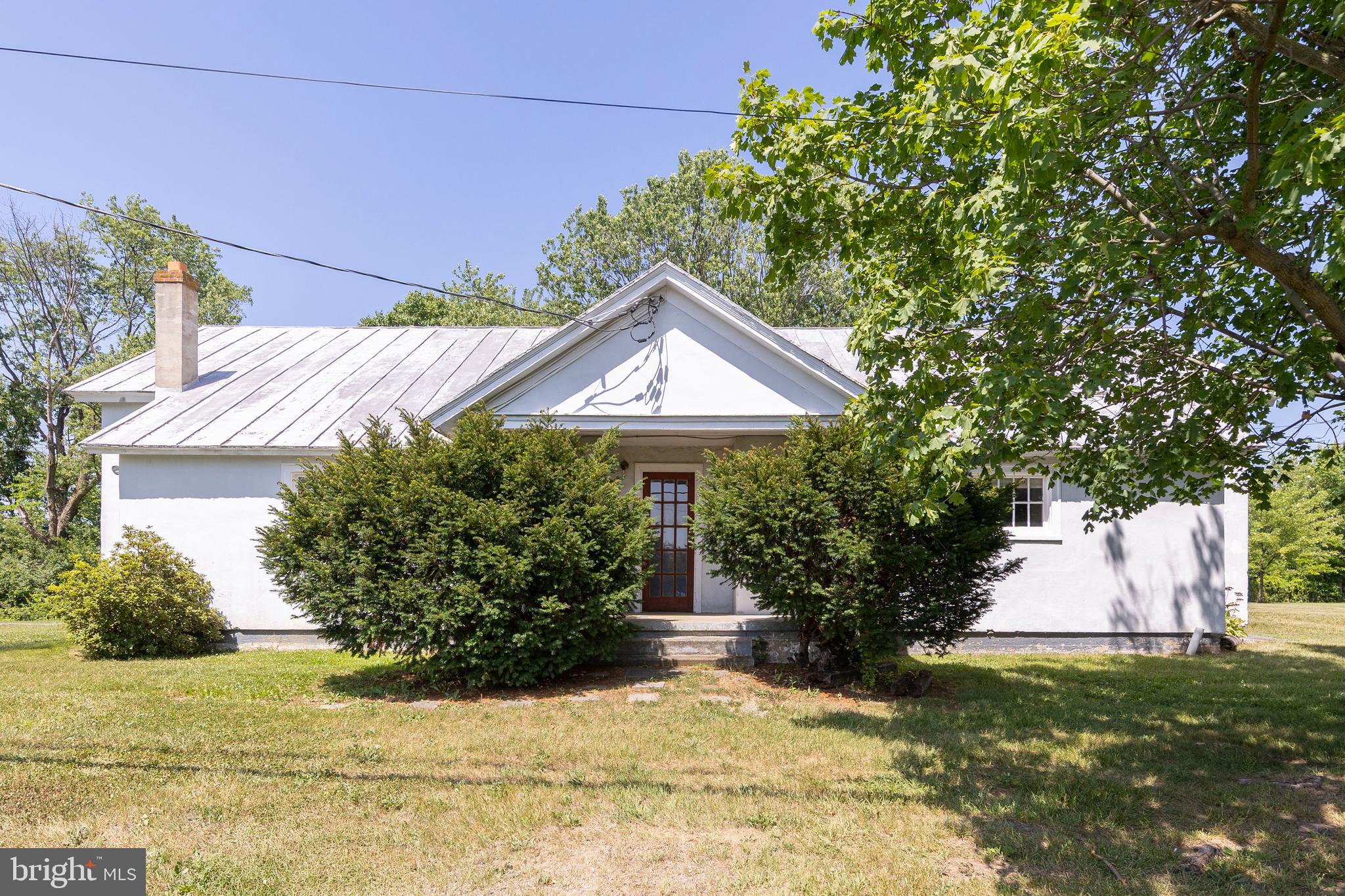 Great investment opportunity! This property is currently configured as two separate 2-bedroom, 1-bath apartments, offering excellent income potential. While both units could benefit from some TLC, the possibilities are abundant. Situated on 6.12 acres in a peaceful country setting, the expansive lot provides ample space for future expansion, additional improvements, or other investment opportunities. Don't miss this chance to add value and maximize the property's potential!