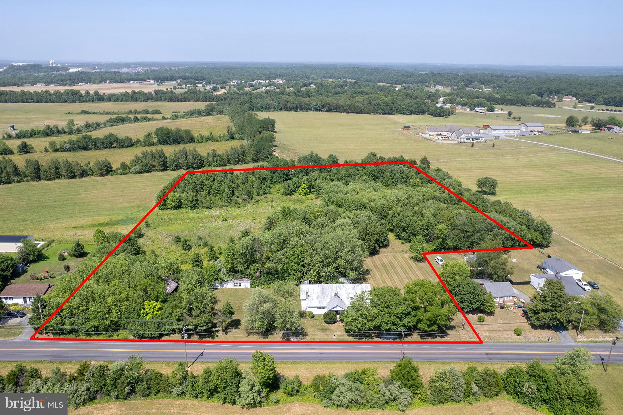 Great investment opportunity! This property is currently configured as two separate 2-bedroom, 1-bath apartments, offering excellent income potential. While both units could benefit from some TLC, the possibilities are abundant. Situated on 6.12 acres in a peaceful country setting, the expansive lot provides ample space for future expansion, additional improvements, or other investment opportunities. Don't miss this chance to add value and maximize the property's potential!