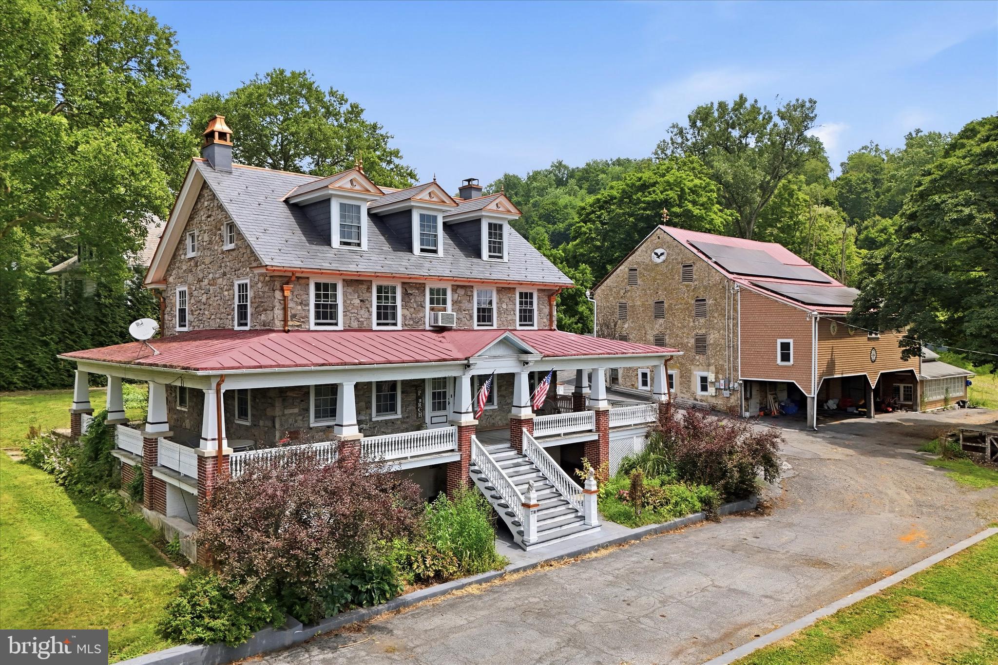 Discover this exceptional 2.5 story, 6 bedroom, 2.5 bath residence with ties to the Pennybacker Orchards, set on 3.2 acres located in Upper Milford Township within the highly regarded East Penn School District. This property offers a rare combination of residential elegance, functional workspace, and premium outdoor amenities.
The home is highlighted by a new slate roof featuring custom copper accents and copper downspouting, delivering both timeless beauty and long term durability. Inside, you will find a very spacious living room, a large kitchen and beautiful dining room on the first floor, beautiful inlaid hardwood flooring in all the bedrooms, and a full basement for storage.
Outdoor living shines with a custom pool, full wrap around porch and side patio, perfect for entertaining or relaxing in a private, picturesque setting. A standout feature of the property is the massive barn, providing substantial storage for vehicles, equipment, or inventory. Attached to the barn is a heated hobby shop, ideal for year round projects, trades, or specialized work.
The property has served as the home base of a construction company, making it an excellent opportunity for contractors, business owners, a potential bed and breakfast or anyone seeking extensive workspace without sacrificing residential charm. Equipment and tools are negotiable, offering added value for the right buyer.
A unique offering with acreage, craftsmanship, and business ready infrastructure, this property is designed to support a wide range of lifestyles and professional needs.