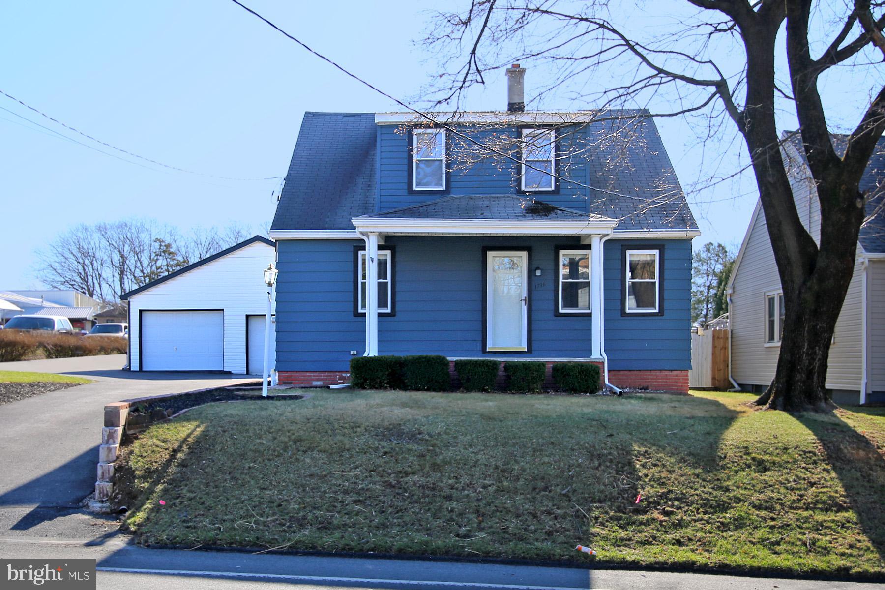 Beautiful Cape Cod style home with a massive 5 car garage! If you need storage, an area to have a workshop, or a place to park your car collection, this is the home for you! This property offers a convenient location with a level .41 acre lot. The home boasts new flooring, a totally updated bathroom, and fresh paint throughout. You will enjoy the 10x25 ft enclosed porch on the side of the garage along with the inviting fire pit and wooden deck for entertaining! This home has so much potential to expand living space. There is an unfinished bonus room on the 2nd floor that could be finished into a 3rd bedroom with little work. Both bedrooms are sizable with walk-in closet spaces available. This property has so much to offer! It's a must see! Schedule your showing today before it's gone!