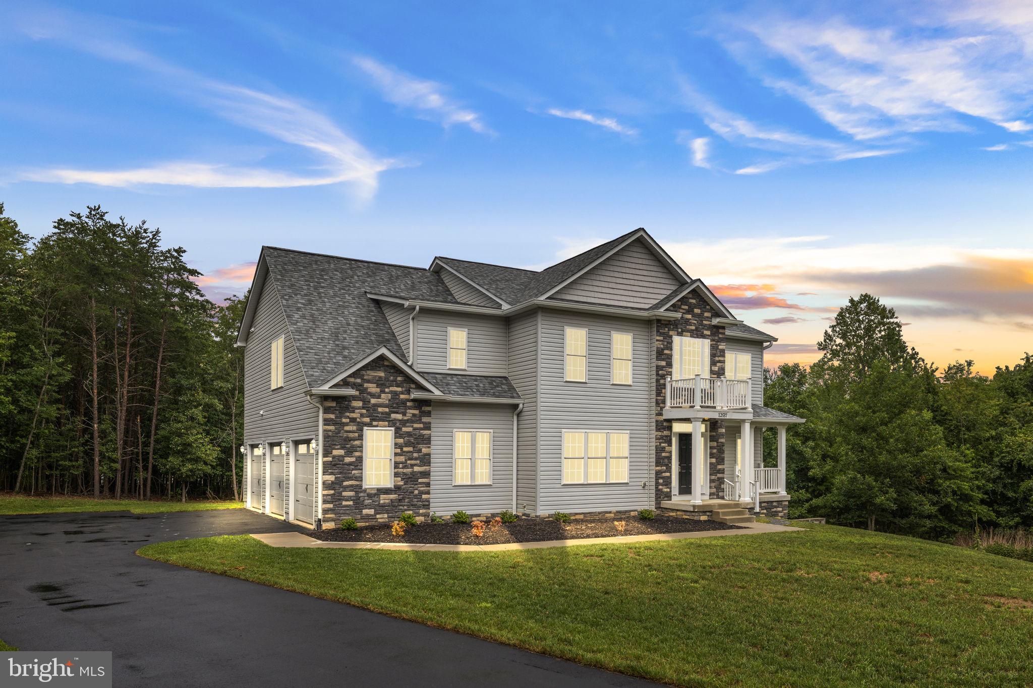 Completed in 2025, this exceptional Colonial-style home offers the perfect balance of modern luxury, thoughtful design, and peaceful living on a beautifully situated 2.06-acre lot. Attractive vinyl siding with stone accents, architectural bump-outs, custom retaining walls, and two spacious decks overlooking the private backyard create impressive curb appeal and inviting outdoor spaces for entertaining or unwinding.
Inside, you'll find an open, light-filled floor plan enhanced by upgraded water- and fire-resistant SPC luxury vinyl plank flooring, crown molding, and recessed lighting throughout. Designed for both everyday living and entertaining, the gourmet kitchen is a true centerpiece, featuring stainless steel appliances, granite countertops, and two oversized islands that provide abundant workspace and seating. The kitchen flows effortlessly into the spacious family room, where a striking corner gas fireplace with glass doors creates a warm and inviting gathering space.
The home offers four generously sized bedrooms and three-and-a-half bathrooms, including an expansive primary suite designed as a private retreat. Relax in the sitting area with your favorite book or enjoy a quiet evening watching television. The luxurious ensuite bath features a soaking tub, a large walk-in shower, dual vanities, and a spacious walk-in closet. Each additional bedroom offers generous closet space and abundant natural light.
Formal and casual dining options include an elegant dining room for special occasions and a bright breakfast area for everyday meals. Upstairs, a large bonus family room provides the perfect space for movie nights, a playroom, a home office, or an additional lounge area.
Need more room? The unfinished walkout basement opens to a custom patio and endless possibilities for future expansion, whether you envision a recreation room, home gym, workshop, guest suite, or additional living space.
Practicality meets convenience with an oversized three-car attached garage, generous driveway parking, and ample storage throughout the home.
Located in the desirable Riverbend High School district, this property offers easy access to parks, shopping, dining, and everyday conveniences while maintaining the privacy and tranquility of a wooded homesite.
More than just a beautiful new home, this is a place where luxury, comfort, and functionality come together to create an exceptional lifestyle. Schedule your private tour and experience everything this remarkable property has to offer. Some photos are virtually staged.
