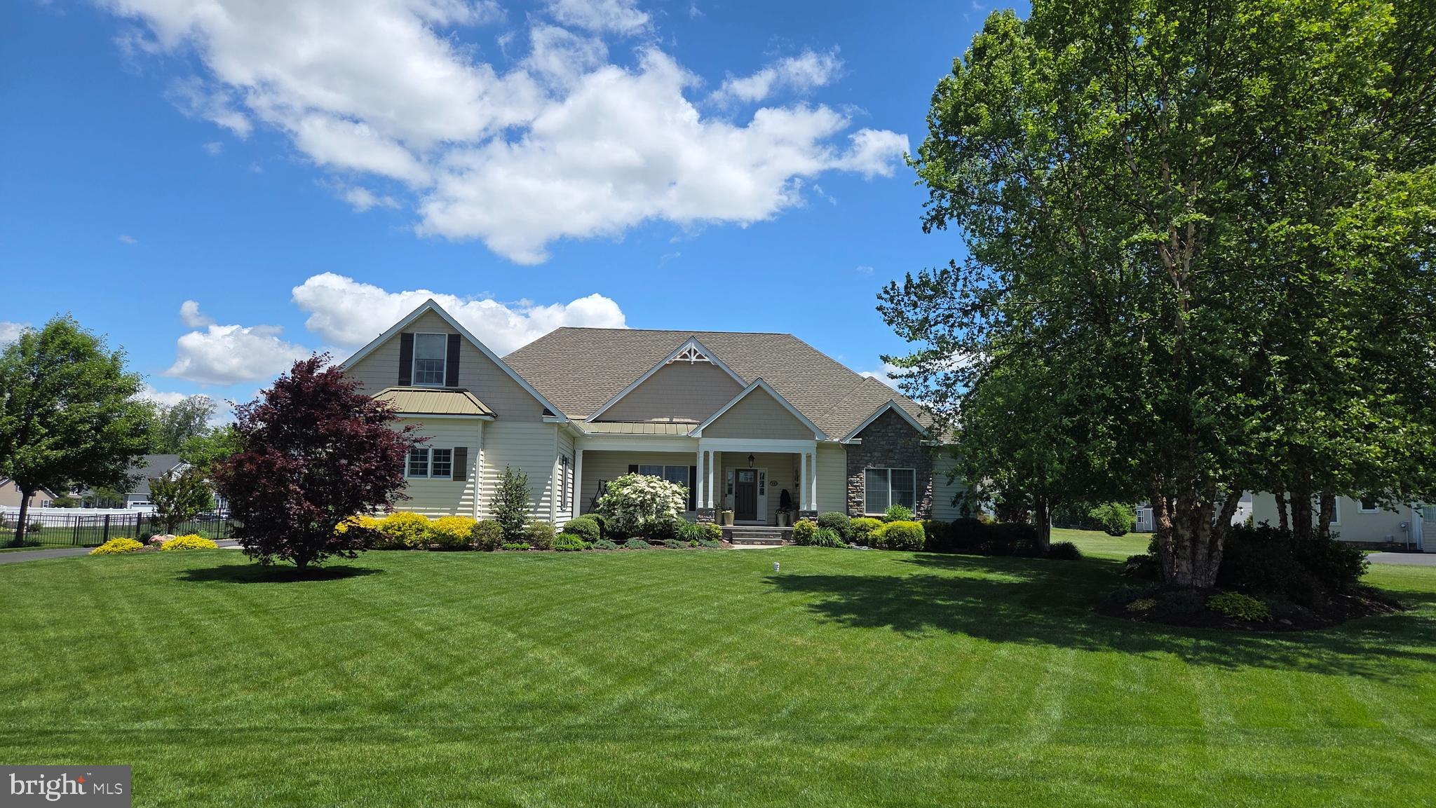 Welcome to this exceptional Garrison Custom ranch home offering 3,100 square feet on the main level plus a beautifully finished basement, all situated on a professionally landscaped 0.63-acre lot. This home is located in the sought-after Townsend Fields community within the highly desirable Caesar Rodney School District.  Thoughtfully designed with quality craftsmanship, energy efficiency, and luxury finishes throughout, this one-of-a-kind property offers the perfect blend of elegance, comfort, and modern convenience—ideal for buyers relocating to Delaware and looking to enjoy spacious living with the added benefit of Delaware’s tax-friendly lifestyle. Conveniently located near restaurants, shopping, major commuter routes, and a short drive to the Delaware beaches, this home delivers both privacy and accessibility.
The exterior showcases Carolina beaded siding, Andersen 400 Series windows and sliding doors, a fully landscaped yard, black aluminum fencing, irrigation system, Generac Emergency Generator, whole-house surge protection, and an expansive MoistureShield composite deck featuring Cool Technology and a 50-year warranty—creating the perfect outdoor retreat. The oversized side-entry 3-car garage features insulated Clopay Coachman steel doors, insulated walls, extra-tall ceilings, and ample space to accommodate full-size pickup trucks with ease.
Inside, custom details abound including bullnose corners throughout, pet-resistant carpeting, insulated bathrooms, framed mirrors in all four full baths, whole-house humidifier, water softener, water filtration system, Rinnai tankless water heater, upgraded R21 wall insulation, and R38 attic insulation for enhanced efficiency and year-round comfort. A built-in granite computer workspace provides an ideal work-from-home setup.
The gourmet kitchen is designed for both daily living and entertaining with 10-foot ceilings, Wolf Designer cabinetry, Cambria quartz countertops, gas stove,and an impressive walk-in pantry measuring approximately 9’6” x 5’8”. Just off the kitchen, enjoy the bright and inviting three-season room featuring Okna double-slide windows and doors.
The great room centers around a stunning gas fireplace featuring adjustable thermostat controls, temperature sensing, timer, remote operation, variable flame height, fan, ambient lighting, child safety lock, and elegant granite surround and hearth. Coffered ceiling in main bedroom suite.
The finished lower level is built with quality and comfort in mind offering a wet bar with granite countertops, full bath, dimmable lighting, aluminum framing, composite walls, sound-reducing Rockwool insulation and ceiling tiles between floors, partially finished storage, conditioned and insulated crawlspace, and upgraded PVC trim details throughout.
The home also offers exceptional future expansion opportunities with a pre-wired and pre-plumbed second-floor area including an additional 270 sq ft room and an expansive 840 sq ft bonus area ready for finishing—perfect for a home theater, guest suite, fitness room, additional bedrooms, or multigenerational living.
This remarkable custom home combines luxury construction, thoughtful upgrades, energy efficiency, and future flexibility in one of Kent County’s premier communities—an exceptional opportunity for buyers seeking quality craftsmanship and an easy Delaware lifestyle.