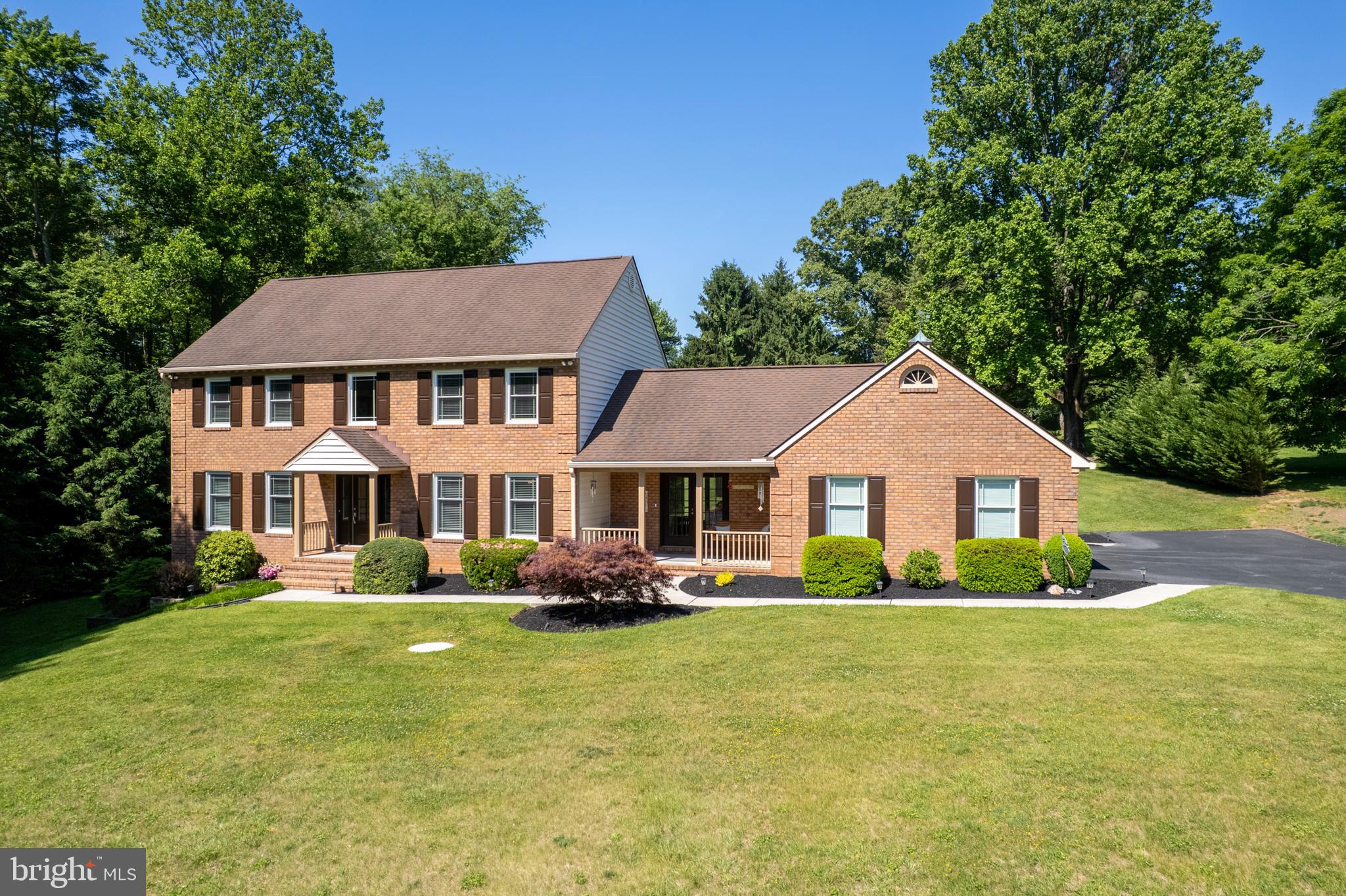 Welcome to 3828 Justin Road — a beautifully updated home nestled on two private, tree-lined acres in Monkton. This rare retreat masterfully blends privacy, modern sophistication, and timeless charm, offering a peaceful escape that’s still just minutes from everyday conveniences.

Sunlight pours through Pella windows, illuminating rich hardwood floors, crisp millwork, and thoughtfully chosen finishes throughout. The heart of the home is a stunning kitchen featuring quartz countertops, sleek modern cabinetry, warm bamboo flooring, and a layout designed for both serious cooking and effortless entertaining.

Just steps away, the family room invites you in with its dramatic stone gas fireplace — the perfect centerpiece for cozy gatherings or quiet evenings. Renovated bathrooms throughout deliver a spa-like experience with elegant fixtures, timeless materials, and elevated design.

The fully finished lower level offers exceptional flexibility — ideal for a media room, home gym, guest suite, or hobby space. Upstairs, generous bedrooms await, anchored by a bright primary suite with a luxurious renovated bath boasting a deep soaking tub, walk-in shower, and double vanities.

Outside, a spacious 33' x 17' Trex deck overlooks a serene, tree-shaded landscape that feels like your own private sanctuary. Thoughtful updates continue with new gutters, downspouts, and gutter guards, a recently redone driveway, and a newer Trane HVAC system for year-round comfort and peace of mind.

This is a rare opportunity to own a private, turnkey home in one of Monkton’s most coveted settings — where every day feels calmer, more beautiful, and completely your own.