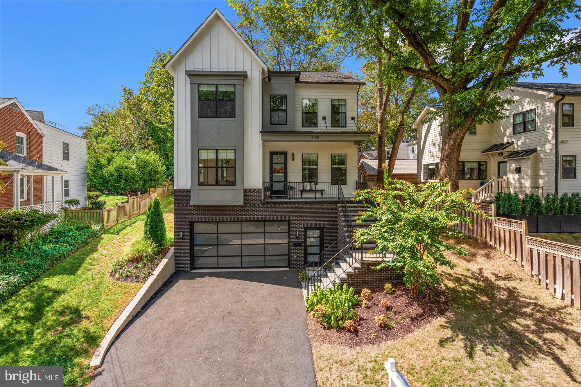 Set on a large lot with a flat, fenced backyard in North Arlington, this 2023 BeaconCrest home offers over 4,000 sq. ft. of beautifully designed living where every detail makes daily life easier and more enjoyable. The open-concept main level connects the gourmet kitchen, breakfast area, and family room so you can cook, host, or simply unwind without missing a moment. A separate dining room and private office give you flexibility for holidays or work-from-home days, while the covered back porch and oversized, flat backyard are made for fall barbecues, soccer practice, or summer evenings with friends.
 
Upstairs, the owner’s suite is a true retreat with an ensuite bath that feels more five-star hotel than Arlington home. Three additional bedrooms, each with bath access, keep everyone close — but not too close. Downstairs, you’ll find space for a home gym, an inviting rec room you actually want to hang out in for movie nights or playdates, and a guest suite for when family comes to visit. The owners have already added designer window treatments and upgraded lighting, so it feels warm and inviting from day one–unlike true new construction where these items are an added cost.
 
And then there’s the neighborhood — one of the things that makes this home so special. You can walk to the Knights of Columbus pool, a hidden gem where locals gather all summer long, with a swim bar called “The Deep End” and events like crab feasts and Derby parties–anyone can get a membership and bypass other Arlington pools’ 7-10 year waitlists. Around the corner, Chestnut Hills Park and Rock Spring Park give kids endless places to run, climb, and play. The block itself is close-knit, with Memorial Day parties, Yorktown football tailgates, and even a neighborhood text chain to keep everyone connected.
 
When you’re ready to step out, you’re a short stroll to Lee-Harrison shops and restaurants (Taco Poblano, Peter Changs, Pietanza, and more) and minutes from Clarendon, Ballston, or Georgetown for date night. Easy access to DC, Tysons, and National or Dulles Airports means you don’t have to compromise convenience for space. And part of Arlington’s top-rated school pyramid — Discovery/Williamsburg/Yorktown.
 
This is more than a new build. It’s a chance to own a home with room to grow in one of Arlington’s most desirable neighborhoods, without giving up the lifestyle and access you love.