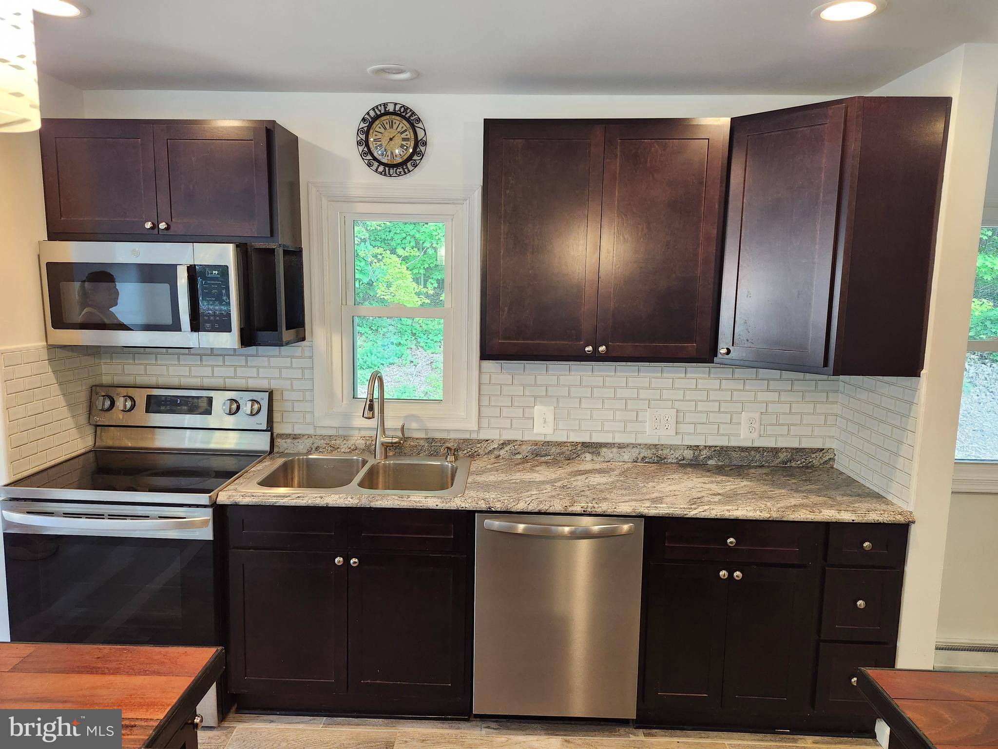Price drop! Recently COMPLETELY renovated, this four bedroom, two full bath offers the best of both worlds - modernized, move-in ready, with rustic charm with beautiful, peaceful views of the Allegany mountains. Step into a large, open space, with a full kitchen, complete with a custom-designed tiger wood island, ceramic and LVP flooring, and bright, airy walls and ceilings. Enjoy the fully finished basement as a large game room, home gym, and/or a fourth bedroom. Tranquility awaits as you step out on your large deck overlooking breathtaking mountains as you enjoy your morning coffee. Less than one hour from Deep Creek Lake, skiing at Wisp, Blue Knob and Whitetail, and just minutes from fishing and hiking - this is your quintessential mountain home.