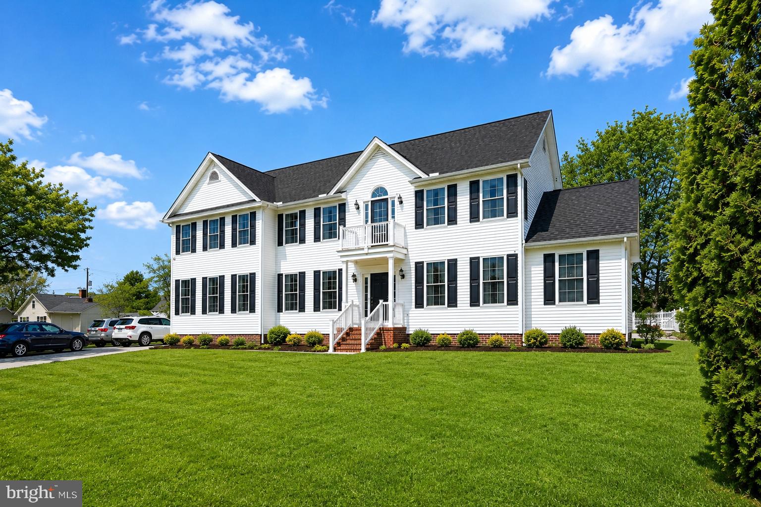 **OWNER FINANCING AVAILABLE**  Welcome to this expansive custom-built Colonial by Piney Island Builders, offering over 4,400 square feet of living space on a private 0.75-acre lot in the heart of downtown Berlin, Maryland. Combining size, flexibility, and an unbeatable location, this 8-bedroom home is ideal for multi-generational living, remote work, vacation living, or anyone seeking a spacious Eastern Shore retreat just minutes from Ocean City beaches. The main level showcases a dramatic two-story great room with soaring ceilings, oversized windows, a gas fireplace, and an open staircase with loft views that fills the home with natural light. Formal living and dining rooms are connected through elegant arched openings, creating a seamless layout for entertaining. The spacious open-concept kitchen overlooks the breakfast area and family room, making it the true center of the home. A standout feature is the highly desirable first-floor layout offering three bedrooms and a full bathroom, providing exceptional flexibility for guest suites, home offices, fitness space, or convenient main-level living. Upstairs, you’ll find five additional bedrooms and two full bathrooms, including a generously sized primary suite with a soaking tub, separate shower, and abundant closet and storage space. The fully finished lower level provides expansive recreation and entertainment space perfect for a media room, game room, home gym, or additional living area. Additional features include public water and sewer, propane heat with underground tank, central HVAC, electric water heater, resurfaced driveway, two storage sheds, and a new refrigerator. The adjacent lot next door is also available, creating a rare opportunity for additional privacy, expansion, or investment potential. Located in one of Maryland’s most desirable small towns, this property is minutes from downtown Berlin’s award-winning shops, restaurants, parks, and schools, while offering convenient access to Ocean City beaches, Assateague Island, golf courses, marinas, boating, and everything the Maryland Eastern Shore lifestyle has to offer. If you’ve been searching for a large home in Berlin, MD with acreage, flexible living space, and proximity to Ocean City, this property offers exceptional value and endless possibilities.