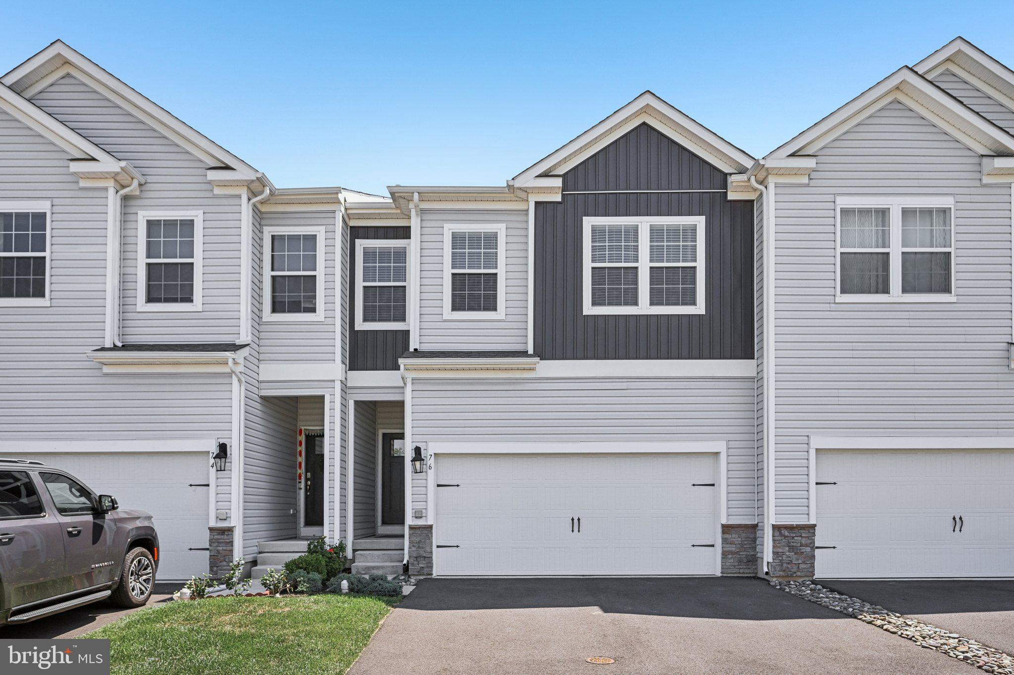 WOW!! Beautifully maintained 4-bedroom, 2½-bath home with a 2-car attached garage is in a quaint, small community with a private backdrop and an exceptionally convenient location. Built in 2022, this home offers the benefits of newer construction without the wait.  So much home for the price, an outstanding value! The bright, open-concept main level features attractive hard surface plank flooring and recessed lighting throughout. The spacious kitchen is designed for both everyday living and entertaining, offering quartz countertops, abundant cabinetry and counter space, a stylish tile backsplash, a large center island with seating, pantry, five-burner gas range, built-in microwave, and dishwasher. The kitchen flows seamlessly into the living and dining areas, creating an inviting space for family gatherings and entertaining. Sliding doors lead to a large rear deck overlooking the private backyard—an ideal setting for morning coffee, outdoor dining, or simply enjoying the peaceful surroundings. A convenient first-floor powder room completes the main level. Upstairs, the spacious primary suite features a walk-in closet and a beautifully appointed ensuite bath with double vanity, linen closet, tiled walk-in shower, and private water closet. Three additional bedrooms offer generous closet space, including one with luxury vinyl plank flooring that makes an excellent home office. A full hall bath with double sinks, attractive tile, and a separate tub/shower and toilet area, along with a convenient second-floor laundry area and oversized walk-in storage closet, complete the second floor. The finished walkout basement adds substantial living space and is perfect for a recreation room, media room, home gym, playroom, or office. Recessed lighting, multiple storage closets, and sliding doors leading to the backyard make this level as functional as it is versatile. This home comes complete with Honeywell Z-Wave Thermostat and Kwikset Smart Door Lock. Located just minutes from shopping, restaurants, and major commuting routes. Less than 10 miles to Nockamixon State Park. This home offers the perfect combination of space, privacy, and convenience. Immaculate and move in ready!
