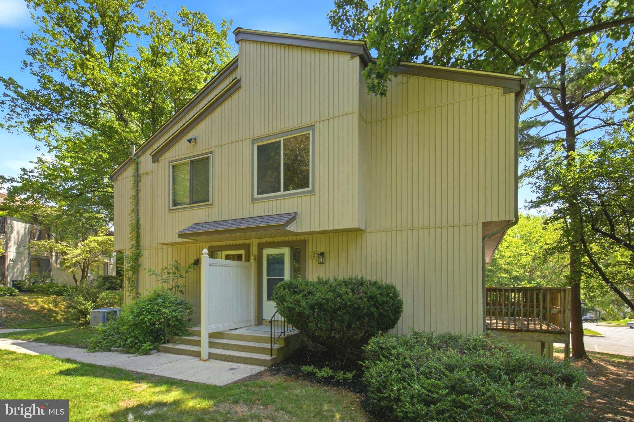 Welcome home to this beautifully updated end-of-group townhome, perfectly situated on a peaceful, tree-lined lot offering added privacy and abundant natural surroundings. From the moment you arrive, you'll appreciate the inviting curb appeal, spacious layout, and thoughtful updates throughout. The bright and airy main level features an open-concept living and dining area with luxury vinyl plank flooring, creating the perfect space for everyday living and entertaining. Just off the living room, step outside to the private rear deck overlooking mature trees, an ideal spot to enjoy your morning coffee or unwind after a long day. The renovated kitchen boasts white shaker cabinetry, quartz countertops, subway tile backsplash, stainless steel appliances, modern black hardware, and ample cabinet and prep space. Upstairs, you'll find three generously sized bedrooms, all with brand-new carpeting, ceiling fans, and large windows that fill each room with natural light. The spacious primary suite offers a peaceful retreat with plenty of closet space, while the updated full bathroom features a modern vanity and stylish finishes. The fully finished walkout lower level provides exceptional additional living space with a large recreation room perfect for a family room, game room, home office, gym, or playroom. A beautifully updated full bathroom and abundant storage make this level as functional as it is versatile. Sliding glass doors provide easy access to the backyard, extending your living space outdoors. Nestled among mature trees yet conveniently located close to shopping, dining, parks, commuter routes, and everyday amenities, this move-in ready home combines modern updates, flexible living spaces, and a tranquil setting you'll love coming home to. Don't miss your opportunity to make this exceptional property yours!