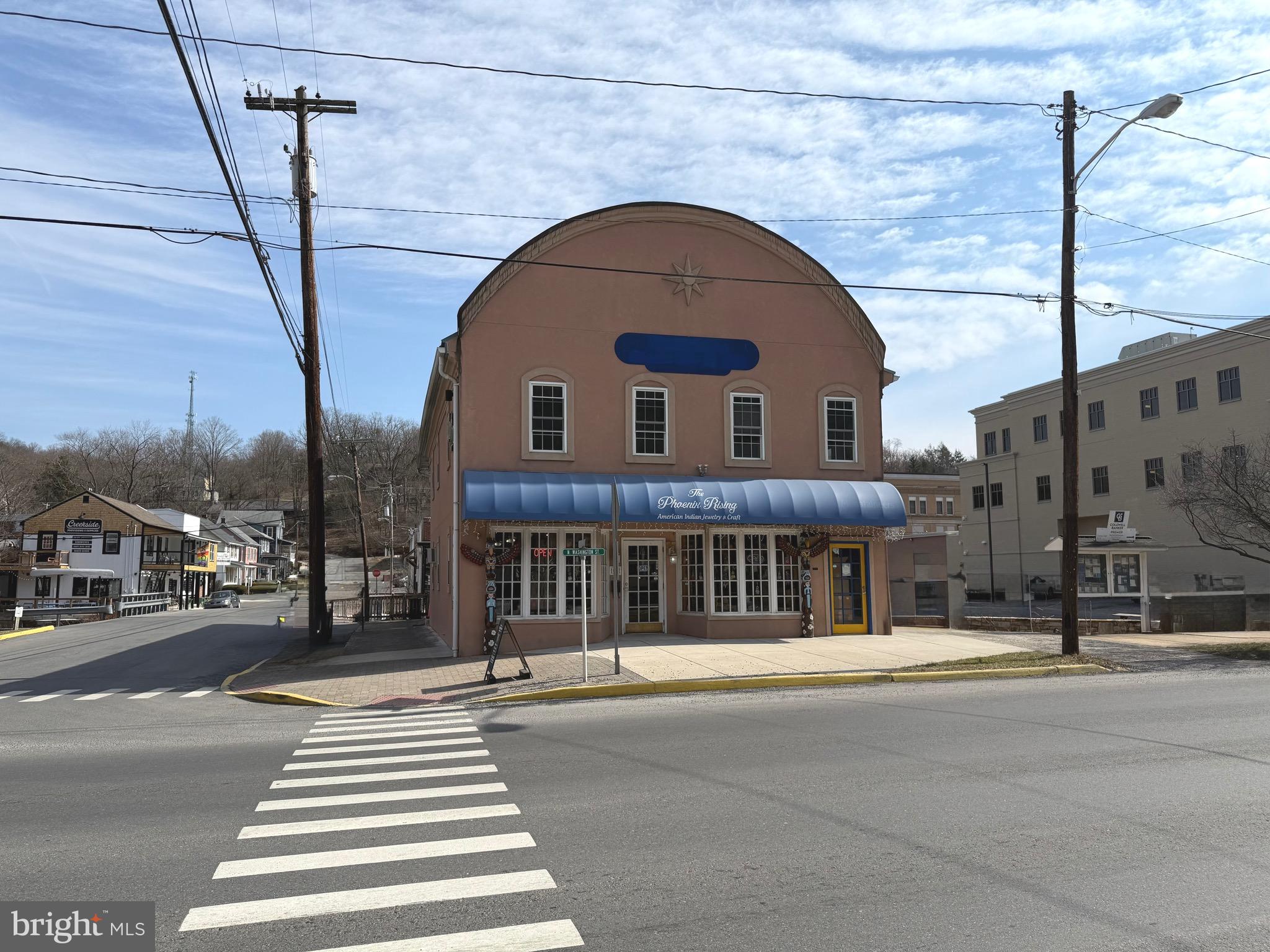 BERKELEY SPRINGS IS A GO TO DESTINATION!  Consider the potential opportunities for your new commercial venture at this .26-acre property in downtown Berkeley Springs. Renovated in 2002-2003, the property boasts a spacious open area, half bath, and office space on the main level. The upper level features separate access, an open area, built-in bar, two half baths, and space for a kitchen. Although some refurbishment is required, the property's prime location near spas, artsy shops, restaurants, and breweries makes it a promising investment.   The upper level has a fresh coat of interior paint!  What are you waiting for?  Come enjoy small town living at it's best!