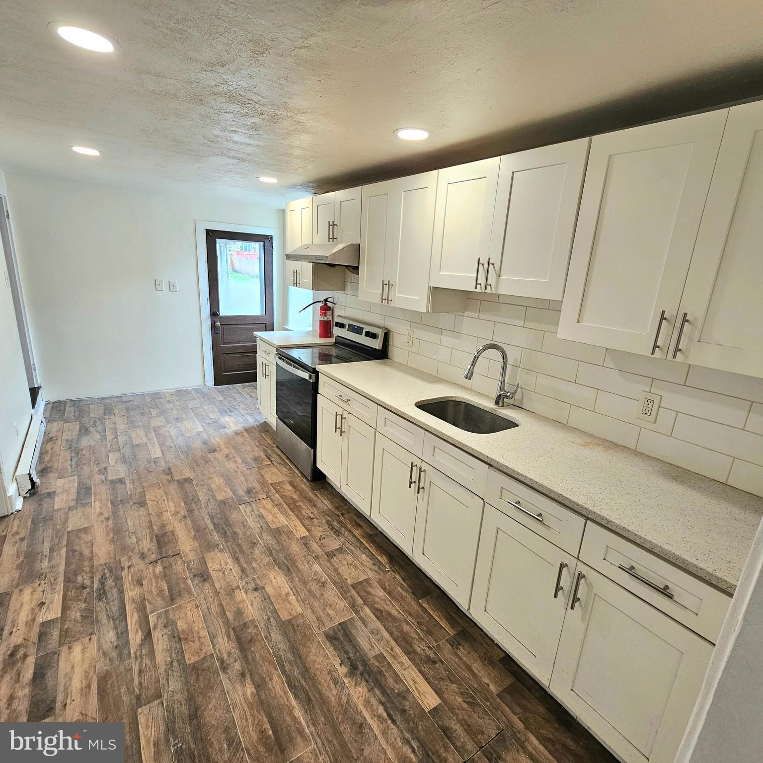 Welcome to this 4-bedroom, 1-bath home offering 1,689 square feet of living space, situated on a large 6,592 sq ft fenced-in lot. Recently freshly painted with laminate flooring throughout, this home is move-in ready and ideal for a home buyer or investor.  The generous layout provides comfortable living areas and ample bedroom space, while the expansive private back yard offers endless possibilities for outdoor enjoyment, entertaining, or additional use.  With its sizable lot and flexible layout, the property may also present unique opportunities for buyers seeking live/work potential or additional exterior space (buyer to verify permitted uses with local zoning).  Conveniently located near major roads, shopping, and local amenities, this property combines comfort, value, and potential.  Schedule a showing and see what else this listing has to offer.  Don’t miss your chance to make this versatile property your own!