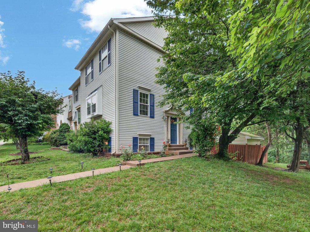 This charming end-of-row townhouse, built in 1987, offers a perfect blend of traditional and split-level architectural styles, making it a delightful retreat for anyone seeking comfort and convenience. Nestled on a generous 0.7-acre corner lot, this home boasts a well-maintained exterior with durable metal siding, ensuring both aesthetic appeal and longevity. Step inside to discover an inviting interior that exudes warmth and style. The spacious layout features three bedrooms and three full bathrooms, along with a convenient half bath. The heart of the home is the combination kitchen and dining area, complete with upgraded countertops and an eating area perfect for casual meals or entertaining guests. The kitchen is equipped with modern stainless steel appliances, quartz countertops, and white cabinets,  dishwasher, microwave, and refrigerator, making meal preparation a breeze. Natural light floods the living spaces through bay and bow windows, enhancing the cozy atmosphere. Gather around the wood-burning fireplace in the basement rec room, creating a perfect spot for relaxation on chilly evenings. The home also features beautiful wood floors and ceramic tile, adding a touch of elegance throughout. The fully finished basement offers additional living space with an outside entrance, ideal for a home office, playroom, or guest suite. Enjoy the convenience of laundry facilities located in the basement, making chores easy and efficient. Outside, the property features a lovely deck and patio, perfect for outdoor gatherings or quiet moments in the fresh air. With two dedicated parking spaces in the lot, accessibility is never a concern. Located in a desirable community, this home is surrounded by a wealth of neighborhood benefits. Residents can enjoy nearby parks, perfect for strolls or weekend picnics.  Public services are readily available, ensuring a well-maintained and good environment for everyone. With an association that includes snow removal and trash services, you can spend more time enjoying your home and less time on upkeep. This property is not just a house; it's a place to create lasting memories. Experience the comfort and convenience of this delightful townhouse, where every detail has been thoughtfully designed for modern living, plus fresh paint all throughout the house, windows in the living room are brand new, and the roof is less than 2 years old.