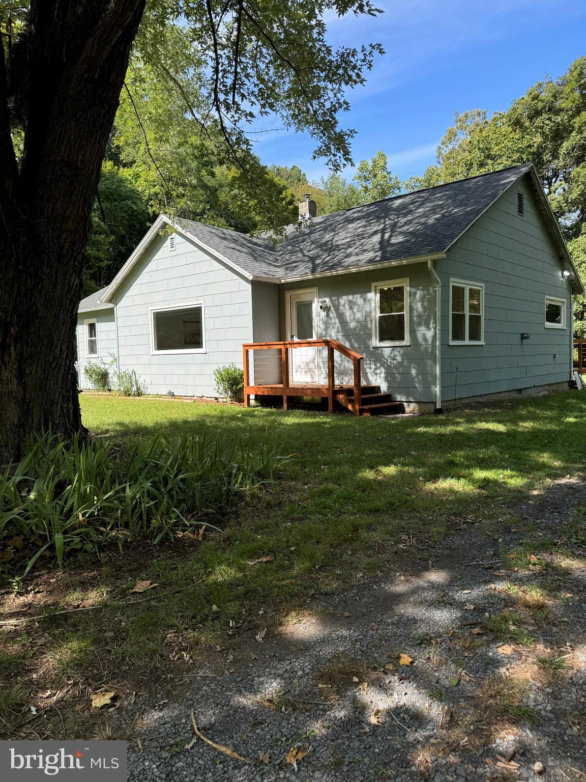This turnkey home offers endless opportunities! Newly renovated home on 1.68 unrestricted acres along the river.  This bungalow offers 3  bedrooms and 1 generous  bath.  The view from the living room windows boast the beauty of the peaceful river, trees and mountains.  Enjoy the beauty of the outdoors but also the convenience of an EV charging station system for car or camper/RV hookup, broadband internet, and  Wi-Fi calling.  Upgrades include brand new shingle roof, beautiful vinyl plank flooring, new grey cabinets, top of the line stainless steel appliances,  impressive tile work in the bath and a SMART door lock system.  Home also features a camera video and audio security  system.  Spend time fishing or swimming, shopping, dining,  or bowling at nearby locations or hiking and visiting WV tourists attractions such as Seneca Rock, Dolly Sods, Blackwater Falls or Canaan Valley Ski Resort.  So many possibilities.  Weekend haven, full time residence, or Air BnB.  Schedule a showing to appreciate all of the amenities.