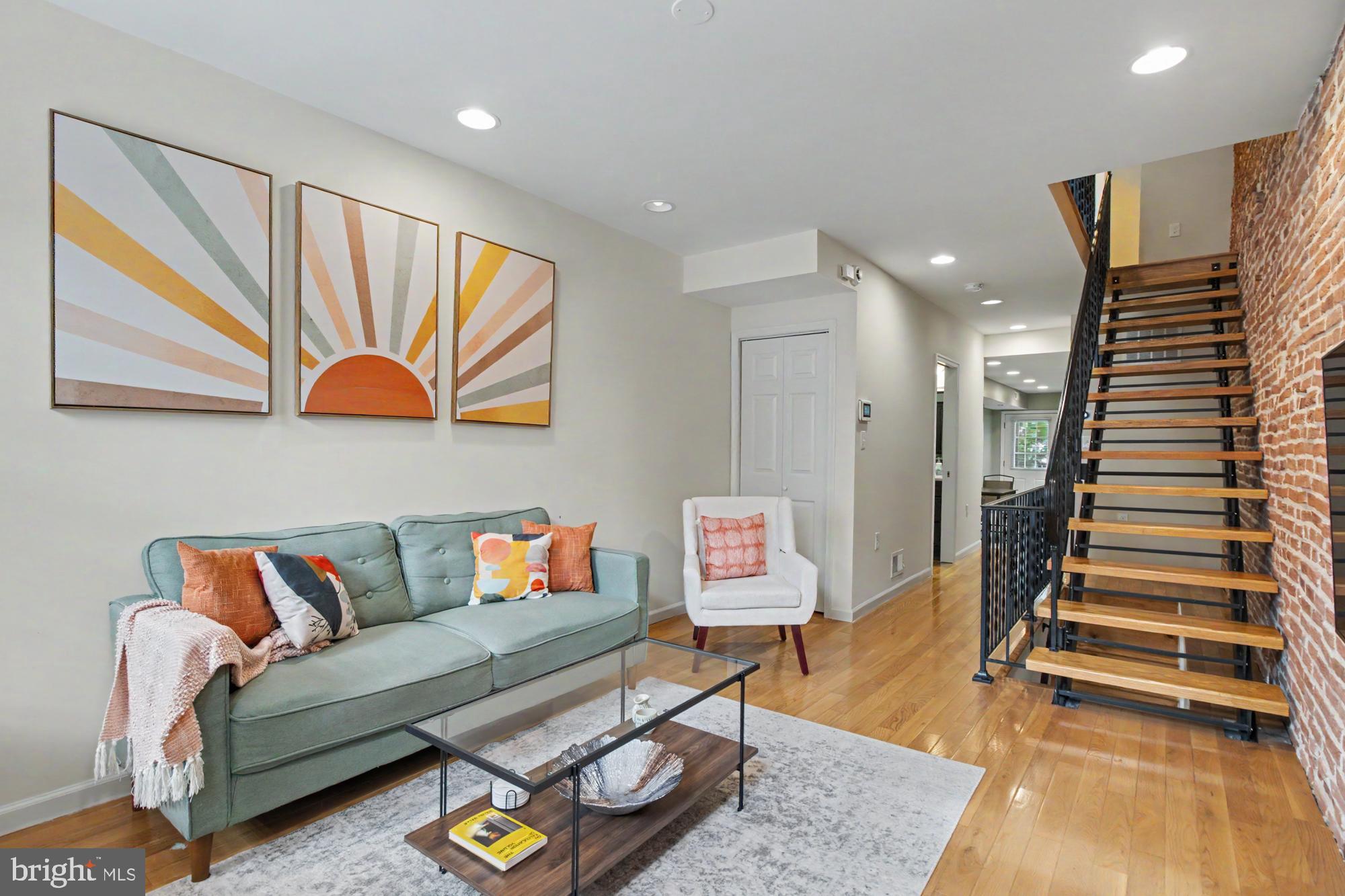 Experience the best of city living in this beautifully updated Canton rowhome, ideally located just moments from some of Baltimore's most popular restaurants, shops, waterfront attractions, and nightlife. Combining classic Baltimore character with modern updates, this home offers the perfect blend of charm and convenience.

Inside, you'll find warm hardwood floors, exposed brick accents, and an inviting open floor plan designed for comfortable everyday living and entertaining. The updated kitchen features stainless steel appliances, ample cabinet space, and easy access to the private rear yard.

The upper level offers two spacious bedrooms filled with natural light, along with the convenience of second-floor laundry. One of the bedrooms opens to a private rear deck, creating the perfect spot to enjoy your morning coffee or unwind after a long day.

The finished lower level provides valuable additional living space that can be used as a recreation room, home office, workout area, or media room. Additional features include a tankless water heater, 1.5 baths, and a fenced backyard ideal for outdoor gatherings or relaxing in your own private outdoor retreat.

Whether you're looking for a primary residence or an opportunity to enjoy one of Baltimore's most vibrant neighborhoods, this move-in ready Canton home delivers location, style, and functionality all in one package.