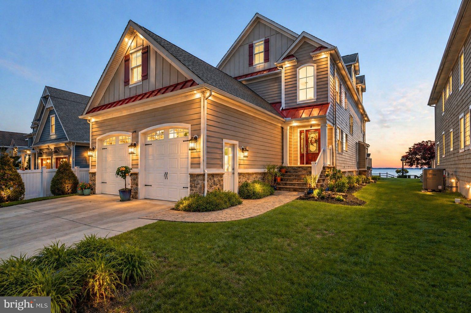 Experience extraordinary waterfront living in this custom coastal residence, perfectly positioned on high elevation overlooking Middle River with sweeping unobstructed views stretching to the Chesapeake Bay and Eastern Shore. Built in 2015 and designed for both elegant everyday living and grand-scale entertaining, this exceptional 5-bedroom home offers rare craftsmanship, timeless finishes, and panoramic water vistas from nearly every major living space. The sun-filled main level showcases rich hardwood flooring, a stunning gourmet island kitchen with water views, spacious dining area, and an expansive waterfront family room with gas fireplace and walls of glass opening to a large covered deck overlooking the shoreline. A desirable first-floor primary suite, powder room, generous laundry room, and oversized heated two-car garage with soaring 12.5-foot ceilings complete the main level. Upstairs, the magnificent waterfront primary retreat offers a private sitting lounge, walls of glass, covered waterside balcony, three walk-in closets, and a spa-inspired bath featuring a jetted soaking tub, oversized luxury shower, and dual granite vanities. Two additional ensuite bedrooms, each with walk-in closets and private baths, plus substantial walk-up storage over the garage, complete the second level. The third level offers an inviting additional family room with granite wet bar, stainless beverage refrigerator, and charming dormered architecture creating a spectacular flex space for guests or recreation. Designed for entertaining on every level, the lower level is a destination of its own, featuring a fifth bedroom and full bath, theater area with surround sound and gas stone fireplace, full granite bar with stainless appliances, kegerator, game areas, and wide double doors leading to the waterfront grounds. Outside, enjoy resort-caliber amenities including approximately 250-foot pier with two boat lifts, jet ski lift, covered swing, entertaining area, and deep unobstructed water frontage. Additional highlights include Hardie Plank exterior, generator hook-up already wired and gas-plumbed, second laundry area, and exceptional quality throughout. A rare offering combining luxury, elevation, protected investment quality, and true Chesapeake lifestyle.