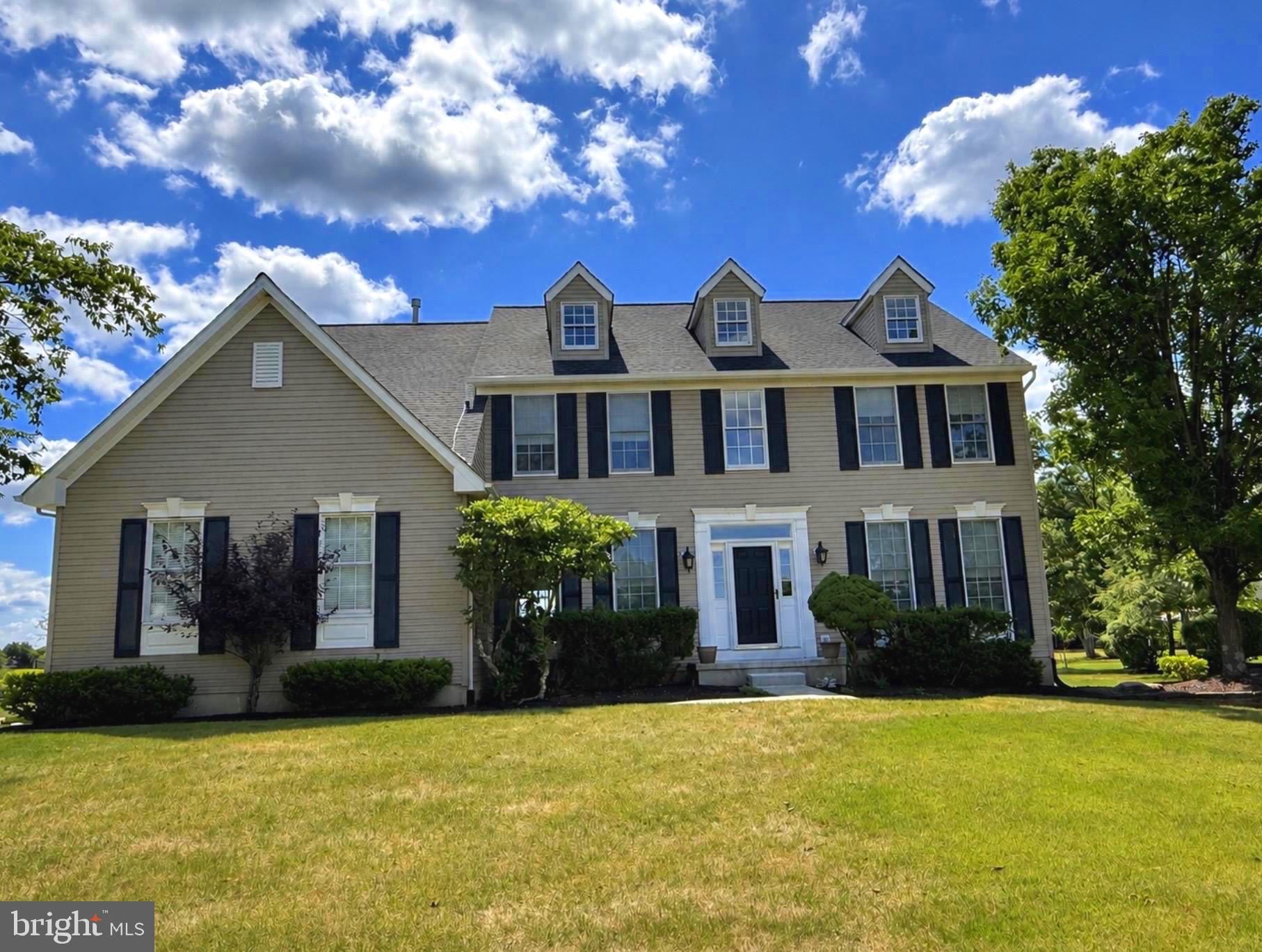 Nestled within the highly desirable enclave of Newtown Meadows, this impeccably updated 4-bedroom, 2.1-bath Colonial showcases designer finishes, exceptional craftsmanship, and the effortless lifestyle today's buyers are seeking. A dramatic two-story foyer welcomes you into a light-filled, open floor plan highlighted by rich hardwood flooring throughout the entire first floor. Elegant formal living and dining rooms flank the foyer, enhanced by stylish accent walls that add warmth, character, and sophistication. Straight ahead, the impressive two-story family room, anchored by a cozy fireplace, creates the perfect gathering space for family and friends. A private home office offers an ideal space for remote work, studying, or a quiet retreat. At the heart of the home is a spectacular, completely renovated chef's kitchen designed to impress. Custom cabinetry with glass display accents, stunning quartzite countertops, a designer tile backsplash, and an oversized center island provide the perfect blend of beauty and functionality. New stainless-steel appliances, elegant pendant lighting, a convenient rear staircase, direct access to the laundry room, and entry to the attached garage complete this exceptional space. Upstairs, the spacious primary suite is a true retreat, featuring a generous sitting room, 2 walk-in closets, and a beautifully appointed en-suite bath. Three additional generously sized bedrooms and a hall bath provide plenty of space for family and guests. The full basement offers endless possibilities for future living space, a home gym, media room, or recreation area. Outside, the private backyard is an ideal setting for entertaining or relaxing, highlighted by a beautiful paver patio perfect for outdoor dining and gatherings. Additional improvements include a replaced roof, added 2nd floor HVAC system, and numerous other thoughtful upgrades that make this home truly move-in ready. Ideally located just minutes from Newtown Village and the charm of Newtown Borough, you'll enjoy convenient access to boutique shopping, exceptional dining, parks, ball fields, top-rated schools, and major commuter routes. Beautifully updated from top to bottom and perfectly situated in one of Newtown's most desirable neighborhoods, this exceptional home offers the ideal combination of comfort, style, and location.