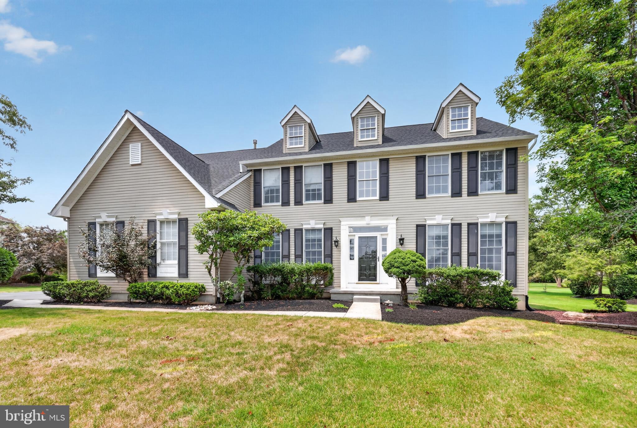 Nestled within the highly desirable enclave of Newtown Meadows, this impeccably updated 4-bedroom, 2.1-bath Colonial showcases designer finishes, exceptional craftsmanship, and the effortless lifestyle today's buyers are seeking. A dramatic two-story foyer welcomes you into a light-filled, open floor plan highlighted by rich hardwood flooring throughout the entire first floor. Elegant formal living and dining rooms flank the foyer, enhanced by stylish accent walls that add warmth, character, and sophistication. Straight ahead, the impressive two-story family room, anchored by a cozy fireplace, creates the perfect gathering space for family and friends. A private home office offers an ideal space for remote work, studying, or a quiet retreat. At the heart of the home is a spectacular, completely renovated chef's kitchen designed to impress. Custom cabinetry with glass display accents, stunning quartzite countertops, a designer tile backsplash, and an oversized center island provide the perfect blend of beauty and functionality. New stainless-steel appliances, elegant pendant lighting, a convenient rear staircase, direct access to the laundry room, and entry to the attached garage complete this exceptional space. Upstairs, the spacious primary suite is a true retreat, featuring a generous sitting room, 2 walk-in closets, and a beautifully appointed en-suite bath. Three additional generously sized bedrooms and a hall bath provide plenty of space for family and guests. The full basement offers endless possibilities for future living space, a home gym, media room, or recreation area. Outside, the private backyard is an ideal setting for entertaining or relaxing, highlighted by a beautiful paver patio perfect for outdoor dining and gatherings. Additional improvements include a replaced roof, added 2nd floor HVAC system, and numerous other thoughtful upgrades that make this home truly move-in ready. Ideally located just minutes from Newtown Village and the charm of Newtown Borough, you'll enjoy convenient access to boutique shopping, exceptional dining, parks, ball fields, top-rated schools, and major commuter routes. Beautifully updated from top to bottom and perfectly situated in one of Newtown's most desirable neighborhoods, this exceptional home offers the ideal combination of comfort, style, and location.