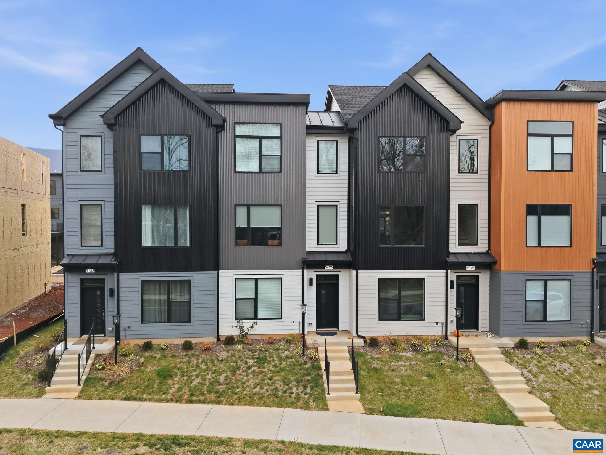 NEW PRICE! BRAND NEW (2025) End Unit in Crozet?s coveted Old Trail. Built by respected local builder Southern Development Homes, this home delivers beauty, function, and efficiency. It features premium exterior finishes and a bright, open main level anchored by an oversized kitchen island perfect for cooking, gathering, or spreading out for work and play. The home comes fully equipped with appliances, including the refrigerator, washer, dryer, and an upgraded range. Enjoy outdoor living on the covered deck, and appreciate thoughtful touches throughout: window treatments, a new shower-head, and a remote-controlled ceiling fan in the workout room. Set in the heart of Old Trail, you?re just a short stroll to the golf course, Restoration restaurant, and the vibrant Old Trail Village with dining, shopping, and ACAC. As an end unit, the home is filled with natural light and enjoys extra privacy with green space directly across the street?plus convenient street parking right out front. This home is also PEARL Gold Certified, showcasing its energy efficiency and year-round comfort. Come take a look today!,Maple Cabinets,Quartz Counter,White Cabinets