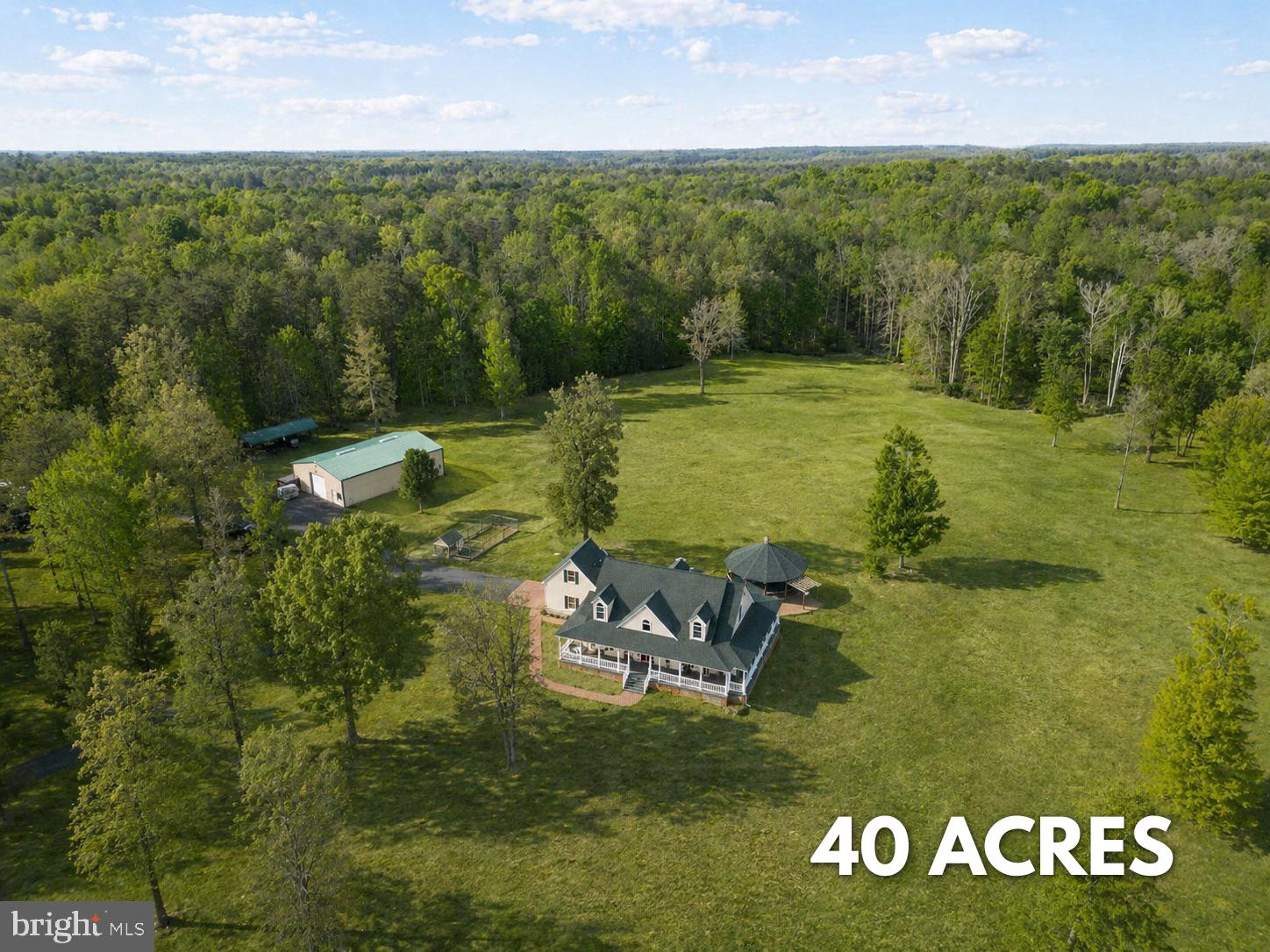 Welcome to your private countryside retreat on 40 acres in the heart of Spotsylvania! This unique property includes two parcels offering endless possibilities for privacy, recreation, farming, or future expansion.

The home is beautifully set back from the road and features a charming front porch, and scenic views of the surrounding land. Enjoy peaceful mornings and quiet evenings while taking in the natural beauty of your own wooded and open acreage.

The property includes a total of 5 bedrooms, with one additional bedroom located in the basement that is not to code, offering flexible space for guests, an office, or a hobby room.

With a mix of cleared land and mature trees, this property is ideal for outdoor enthusiasts, those seeking privacy, or anyone looking to create their dream estate. Conveniently located while still offering a secluded feel, this is a rare opportunity to own a large tract of land in Spotsylvania County.