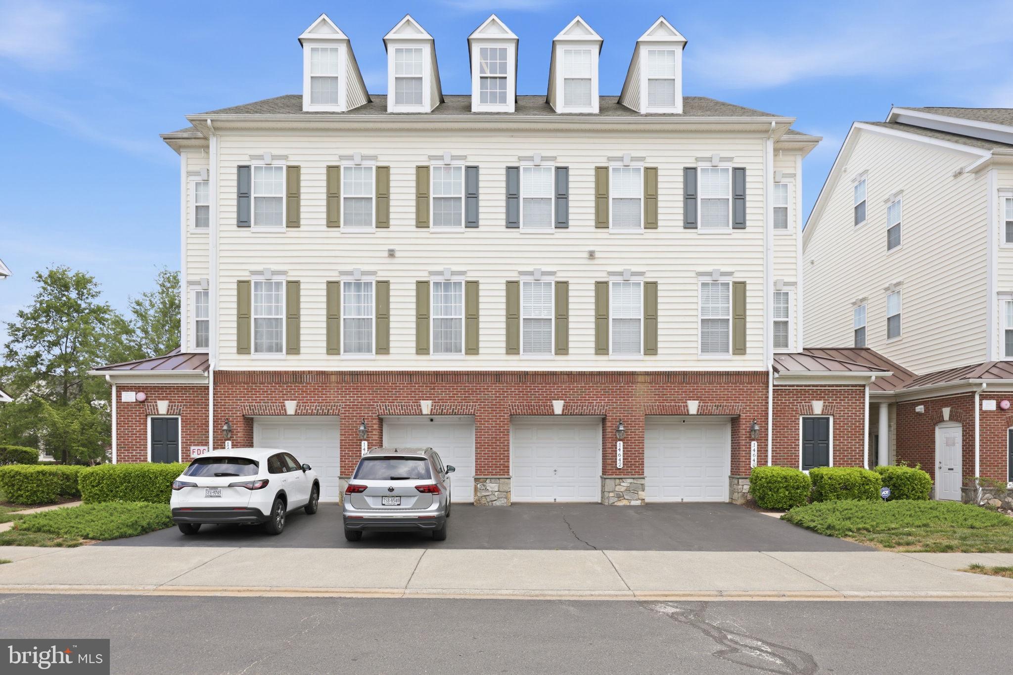 Tucked inside the amenity-filled community of Piedmont South, this end-unit condo townhome offers the space, layout, and updates that are so hard to find in this price point. Spanning four finished levels with a 1-car garage, this home has been thoughtfully updated and meticulously maintained throughout.
The entry level welcomes you with a spacious foyer, powder room, storage space, and direct garage access. Upstairs, the main living level is filled with natural light and features an open-concept layout that works perfectly for everyday living and entertaining. The kitchen has been refreshed with all new stainless steel appliances and offers granite countertops, backsplash, pantry storage, luxury vinyl plank flooring, and an eat-in dining space that flows seamlessly into the cozy family room. Large windows and the end-unit location bring in incredible natural light throughout the day.
The entire third level is dedicated to the primary suite, creating a true retreat with luxury vinyl plank flooring, a large walk-in closet, and a spacious en suite bath complete with double vanities, soaking tub, separate shower, and private water closet. The laundry area is conveniently located on the same level as the primary suite.
The top floor offers two additional bedrooms, a full bathroom, linen closet, and an open loft space that makes the perfect home office, workout area, playroom, or second living space.
Major updates have already been completed for the next owner, including new kitchen appliances, newer HVAC systems, luxury vinyl plank flooring, carpet, washer and dryer, garbage disposal, and fresh interior paint.
Residents of Piedmont South enjoy access to incredible community amenities including a pool, fitness center, clubhouse, basketball courts, tennis courts, playgrounds, and walking trails. Conveniently located just minutes to shopping, restaurants, commuter routes, Haymarket, Gainesville, Jiffy Lube Live, and commuter lots with easy access to I-66 and Route 234. Monthly condo fees include water, trash, landscaping, and community amenities.