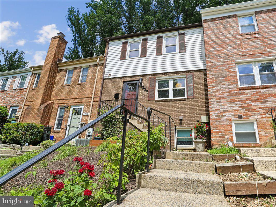 Tucked away at the peak of a quiet cul-de-sac just blocks from Rock Creek Park, this thoughtfully updated, four-level townhouse in Rockville’s  Aspen Hill Park neighborhood offers a blend of suburban tranquility and urban convenience. Step up to the front door and into a freshly painted interior boasting newly refinished hardwood floors and distinct, versatile living spaces designed for effortless connection.

The heart of the home features an updated kitchen complete with brand-new countertops, ample cabinetry, stainless steel appliances, a built-in range, and clever open shelving. This culinary space looks directly out over a loft-style dining area, where a mirrored wall enhances the sense of openness, and a railed overlook peers down into the family room below, keeping conversation flowing naturally between levels. 

As you ascend toward the upper level, a rooftop skylight floods the stairwell with natural light, drawing your eye up to the dramatic vaulted ceilings overhead. This level hosts three newly carpeted, well-sized bedrooms, a primary suite featuring a refreshed vanity counter and sink, and a second full bathroom serving the additional bedrooms.

Just a few steps down from the main living area, the first lower level impresses with soaring ceilings, a full view of the levels above, and large sliding glass doors that open directly to a fully fenced, private rear patio—perfect for al fresco dining or weekend relaxation. The basement level offers a cozy, newly carpeted recreation room equipped with extra cabinetry for additional storage.

Beyond the front door, this convenient location delivers an exceptional commuter experience with quick access to Interstate 270 and two nearby Metro stations, placing the entire DC metro region within easy reach. Enjoy upscale shopping, dining, and entertainment just minutes away at Pike & Rose, or embrace the outdoors with local trail networks and the recreation of Lake Needwood, less than 20 minutes from your doorstep.