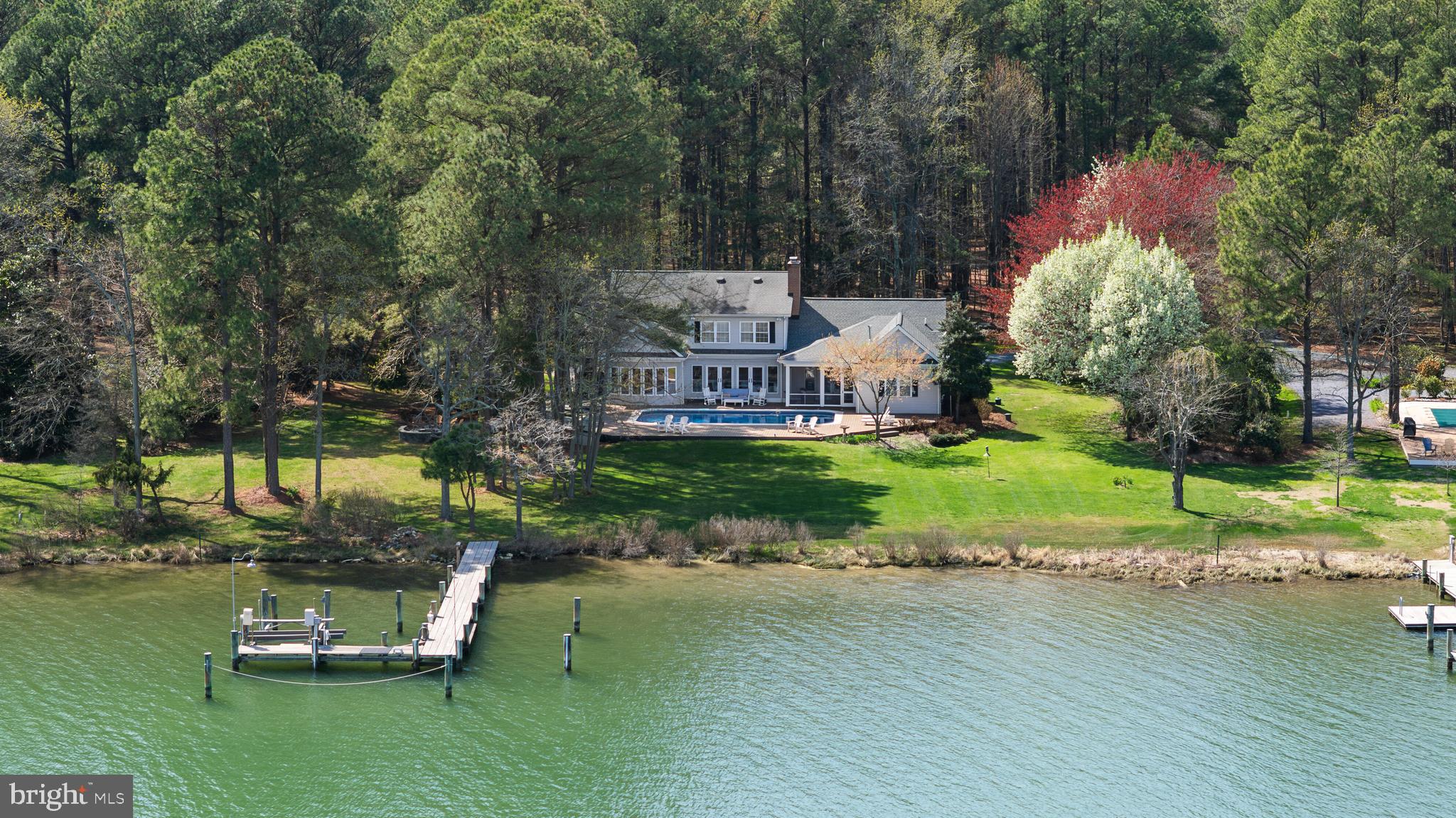 Now Offered at $1,895,000 | Private Harris Creek Waterfront

Private Harris Creek waterfront with pool, pier, boat lift and deep-water access—crafted for boating, kayaking and the best of Eastern Shore living. This five-bedroom, three-and-a-half-bath residence offers a rare blend of privacy, comfort and wide water views just minutes from St. Michaels and Easton.

Sun-filled interiors feature red oak floors, custom built-ins, multiple fireplaces and an inviting layout designed for everyday living and entertaining. The kitchen is the heart of the home with KitchenAid appliances, granite countertops, oversized island seating, butler’s pantry and dry bar. Main-level living includes a waterside primary suite with fireplace, private guest suite, office or den, and additional gathering spaces. Upstairs offers three bedrooms, full bath and spacious family room.

 Outdoor living shines with a screened porch, expansive waterside deck, saltwater pool and firepit patio overlooking Harris Creek. Private pier with boat lift and deep-water access opens the door to endless days on the water. Additional features include a two-car garage with workshop, whole-house generator and new septic system (2025).
An exceptional waterfront opportunity at an outstanding new price.