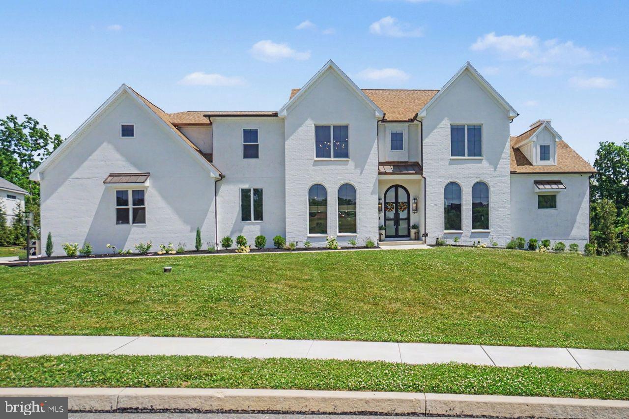 You won't want to miss this exquisite home with thoughtful design, custom millwork, architectural enhancements and impressive ceiling heights throughout. As you enter the vaulted ceiling creates a grand feel. With over 4,400 square feet, this home is ideal for entertaining and modern living. The gourmet kitchen features fully integrated and upgraded appliances with custom panels for a seamless furniture-quality appearance. The custom artisan range hood is both functional and beautiful. Enjoy an abundance of natural light and sweeping views of the golf course from the kitchen window. The open plan flows into the spacious family room where the custom stucco fireplace serves as a stunning focal point that extends across two stories. Working remotely? The dedicated home office space features built-in shelving and oversized arched windows creating character and a contemporary feel. The home's professionally designed technology infrastructure provides seamless, high-speed connectivity throughout the residence, supporting work from home, streaming, smart-home integration, and modern digital living. Retire to the first level primary bedroom which has an ensuite with luxury spa-inspired ambiance. Enjoy the jetted tub and the spacious wet room featuring massage jets. The primary suite has two walk-in closets featuring professionally designed custom closets each with its own washer dryer. Down the hall is the mud room where backpacks or shoes can be dropped in the built-in lockers. The dramatic open-riser staircase is complemented by a stone feature wall expanding three stories giving it an elevated look. On the second level, there are 4 spacious bedrooms each with its own upgraded lighting, customized closets, and vaulted ceilings. The 5th bedroom can be used as a recreation room/second home office. The built-in play set in this space will appeal to kids of all ages. The spacious walk-in closet is large enough to be used as a craft room. No need to scrape ice or snow from your vehicle with the attached 4 car garage, featuring French glass doors for an optional exercise area. The unfinished lower level is an ideal spot for storing seasonal items or holiday decor, an exercise area, or finish and use the walk-out egress stone steps to the backyard. The oversized sliding glass doors from the patio create seamless indoor-outdoor living and entertaining. The large covered back patio has a vaulted ceiling, integrated outdoor tv, and a custom pass-through entertaining window connecting the outdoor bar to the indoor dining bar. Play a game of catch or relax and enjoy some sun in the spacious backyard where mature landscaping and tall fencing provide privacy and tranquility. Premium copper gutters, downspouts, and accent roofing provide timeless architectural character and exceptional durability. You'll feel
secure in this smart home which has a comprehensive security system and a reverse osmosis water filtration system. Located in the desirable Lower Dauphin School District and in close proximity to Hershey Medical Center and the local airport. Schedule your showing for this stunning, luxury home!
