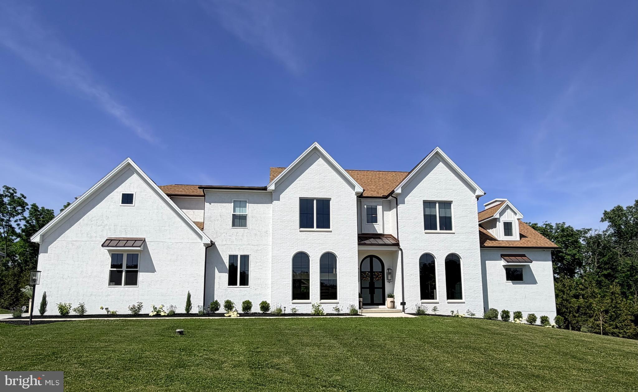 You won't want to miss this exquisite home with thoughtful design, custom millwork, architectural enhancements and impressive ceiling heights throughout. As you enter the vaulted ceiling creates a grand feel. With over 4,400 square feet, this home is ideal for entertaining and modern living. The gourmet kitchen features fully integrated and upgraded appliances with custom panels for a seamless furniture-quality appearance. The custom artisan range hood is both functional and beautiful. Enjoy an abundance of natural light and sweeping views of the golf course from the kitchen window. The open plan flows into the spacious family room where the custom stucco fireplace serves as a stunning focal point that extends across two stories. Working remotely? The dedicated home office space features built-in shelving and oversized arched windows creating character and a contemporary feel. The home's professionally designed technology infrastructure provides seamless, high-speed connectivity throughout the residence, supporting work from home, streaming, smart-home integration, and modern digital living. Retire to the first level primary bedroom which has an ensuite with luxury spa-inspired ambiance. Enjoy the jetted tub and the spacious wet room featuring massage jets. The primary suite has two walk-in closets featuring professionally designed custom closets each with its own washer dryer. Down the hall is the mud room where backpacks or shoes can be dropped in the built-in lockers. The dramatic open-riser staircase is complemented by a stone feature wall expanding three stories giving it an elevated look. On the second level, there are 4 spacious bedrooms each with its own upgraded lighting, customized closets, and vaulted ceilings. The 5th bedroom can be used as a recreation room/second home office. The built-in play set in this space will appeal to kids of all ages. The spacious walk-in closet is large enough to be used as a craft room. No need to scrape ice or snow from your vehicle with the attached 4 car garage, featuring French glass doors for an optional exercise area. The unfinished lower level is an ideal spot for storing seasonal items or holiday decor, an exercise area, or finish and use the walk-out egress stone steps to the backyard. The oversized sliding glass doors from the patio create seamless indoor-outdoor living and entertaining. The large covered back patio has a vaulted ceiling, integrated outdoor tv, and a custom pass-through entertaining window connecting the outdoor bar to the indoor dining bar. Play a game of catch or relax and enjoy some sun in the spacious backyard where mature landscaping and tall fencing provide privacy and tranquility. Premium copper gutters, downspouts, and accent roofing provide timeless architectural character and exceptional durability. You'll feel
secure in this smart home which has a comprehensive security system and a reverse osmosis water filtration system. Located in the desirable Lower Dauphin School District and in close proximity to Hershey Medical Center and the local airport. Schedule your showing for this stunning, luxury home!