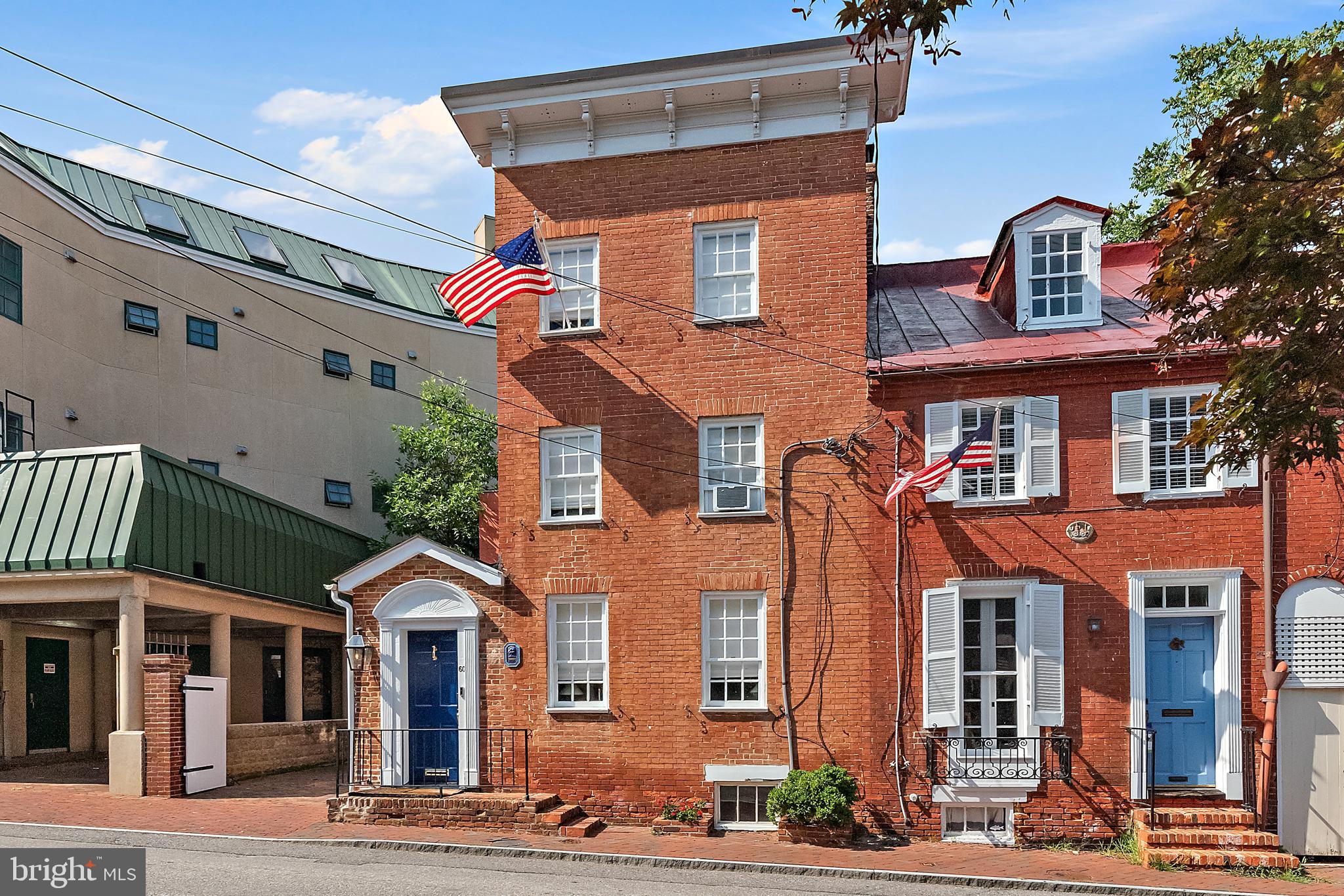 Exquisitely renovated, perfect in-town residence with parking in the shadow of the State House!  From the moment you enter, you will be wowed with the pretty detail and lovely spaces on all three levels.  Open kitchen  has great space to entertain and dine and exceptional storage. Home was redesigned and renovated to maximize comfortable, beautiful and convenient downtown living. Home features lots of custom built ins, great fun fixtures and preserved original material such as heart pine floors. Primary suite has newly renovated bath and nice walk-in closet.  2nd newly renovated bath services the sunny front bedroom. On the 3rd level is another full bath and a large bedroom with built in beds for lots of sleepovers.  Behind the gates  find the private courtyard and patio which can be used for parking or entertaining. Cornhill is a most spectacular location with the State House on one end and the City Dock on the other.  Downtown is at the door step along with dozens of restaurants, shops and a never ending parade of things to do and see!