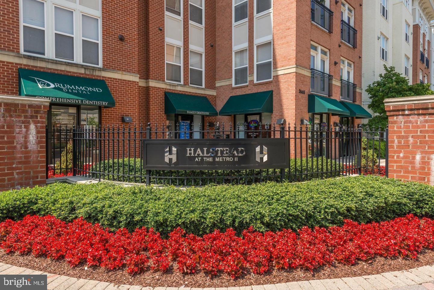 Just steps to the Dunn Loring Metro Station in the sought-after Halstead at The Metro, this beautiful condo boasts elegant hardwood floors, a large bedroom with a spacious walk-in closet, stainless steel appliances with gas cooking, a light-filled open layout with high ceilings, a tree-lined balcony view overlooking the courtyard, a gas fireplace, fresh paint and a garage parking space. Immaculately maintained with various updates including a full-sized washer/dryer (Oct 2025), refrigerator (June 2025) and dishwasher (June 2025). 

The first-class amenities include an outdoor pool and patio, a large, well-equipped fitness center, an indoor basketball court, a club room with billiards, a business center and, conveniently, a 24/7 concierge. This condo is also in the more desirable Halstead 1 building of the community that encompasses all of the amenities as well as the mail room and the concierge. 

The Mosaic District features some of the very best shopping, dining and entertainment options in the area including the Angelika Film Center & Café, Dolcezza Gelato & Coffee, Barnes & Noble, Ted’s Bulletin, Pupatella, TrueFood Kitchen, MOM’s Organic Market, Harris Teeter and much more. 

With low condo fees, first-class amenities and just steps to the Dunn Loring Metro and the Mosaic District, this beautiful condo strikes the perfect balance of a move-in ready home in a quiet yet amenity-rich building in a vibrant and walkable community.